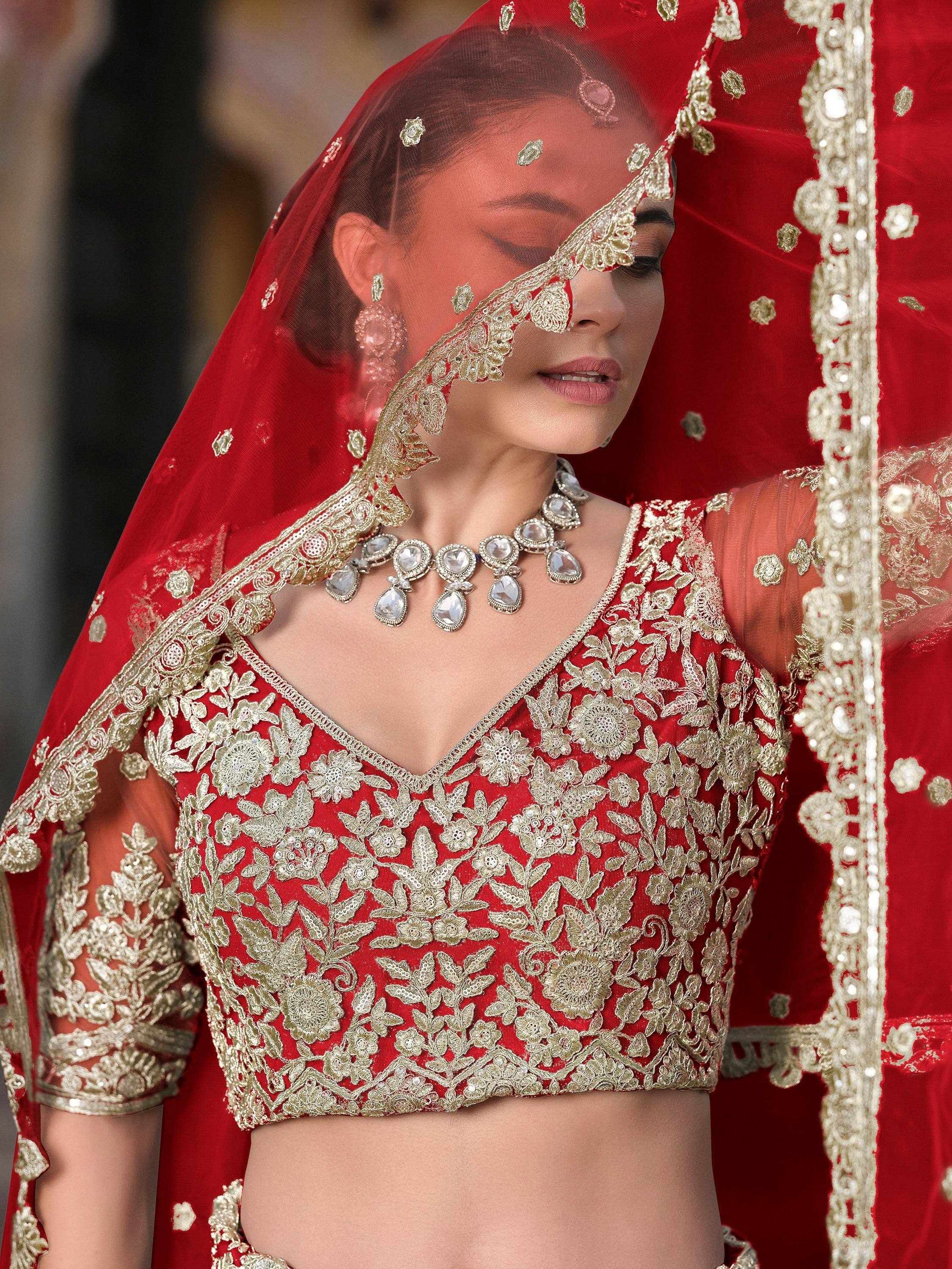 Red bridal lehenga choli with gold embroidery and sheer dupatta, Indian ethnic wear