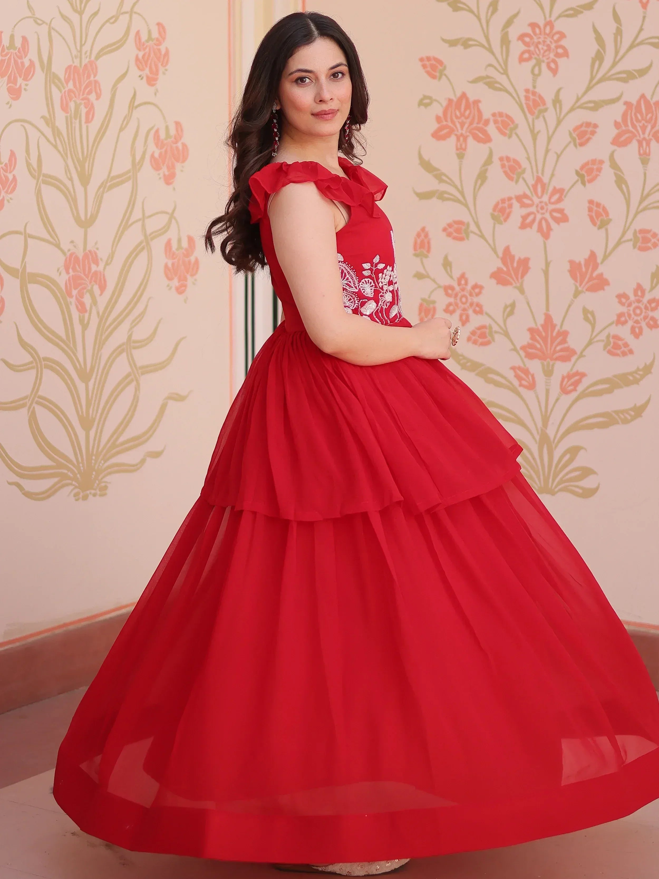 Red ethnic gown with ruffle sleeves and floral embroidery, perfect for Indian festive occasions