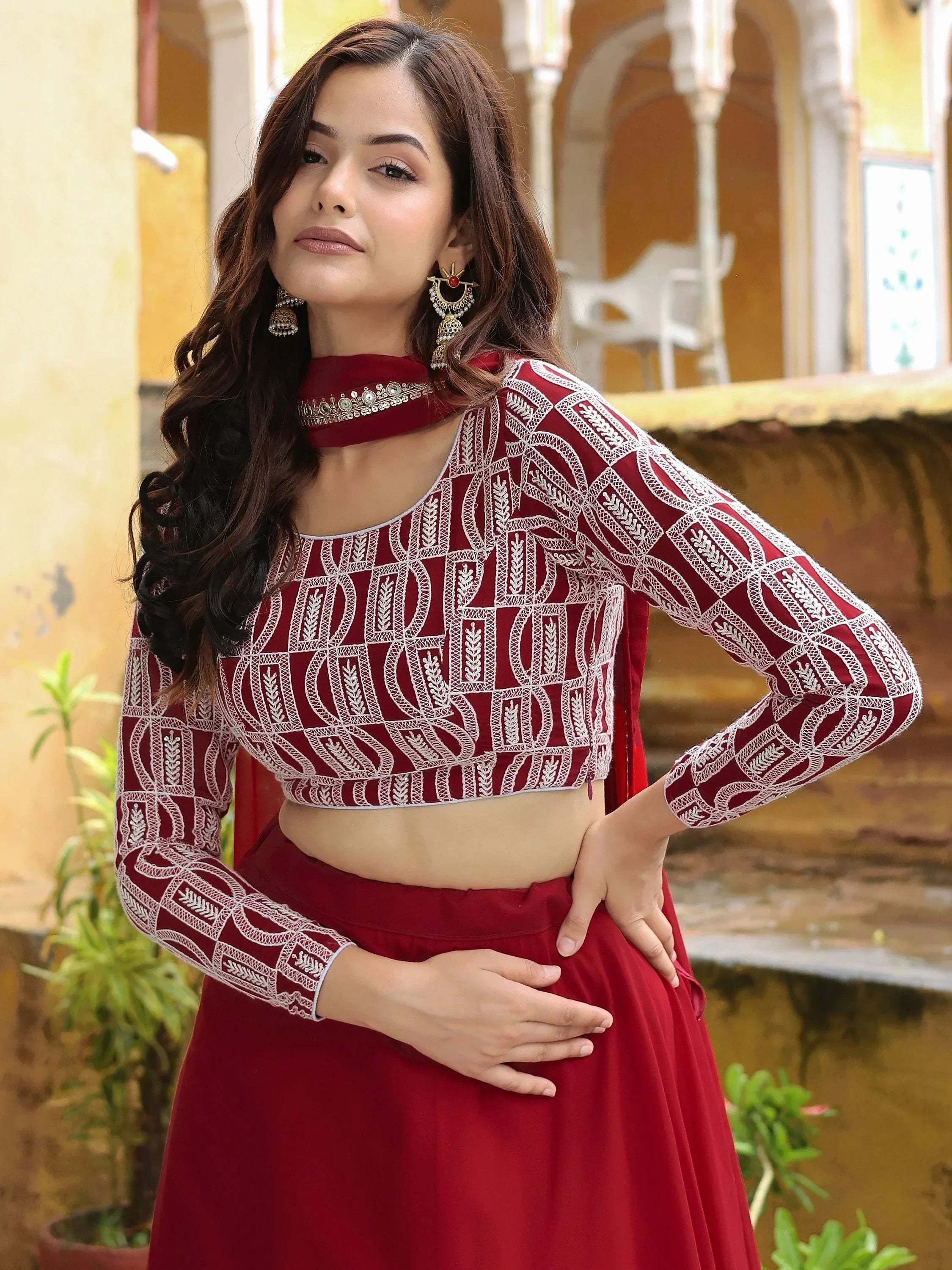 Maroon embroidered lehenga choli with white threadwork, perfect for Indian ethnic wear and festive occasions.