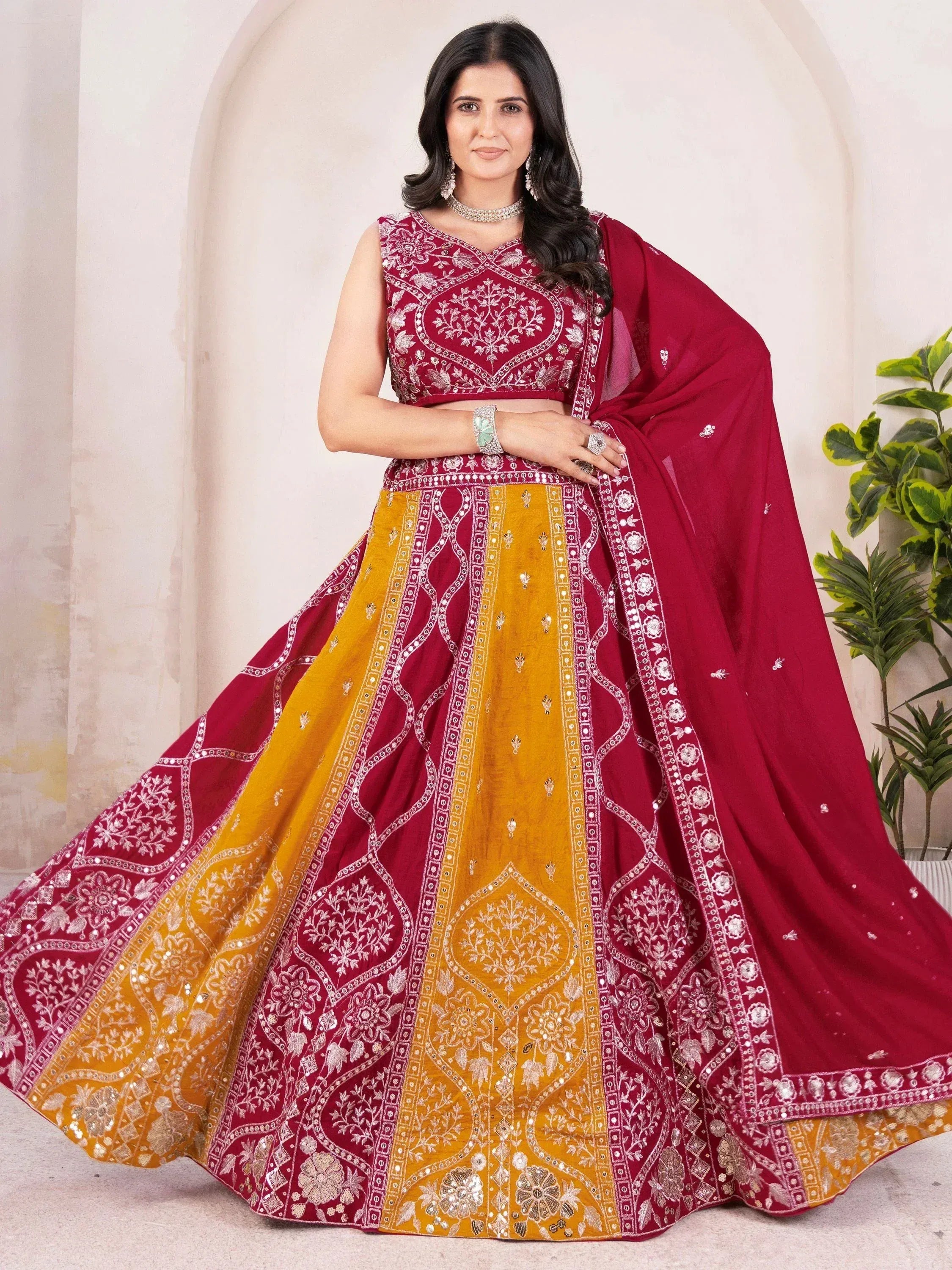 Maroon and mustard designer lehenga choli with intricate embroidery and mirror work for Indian ethnic wear