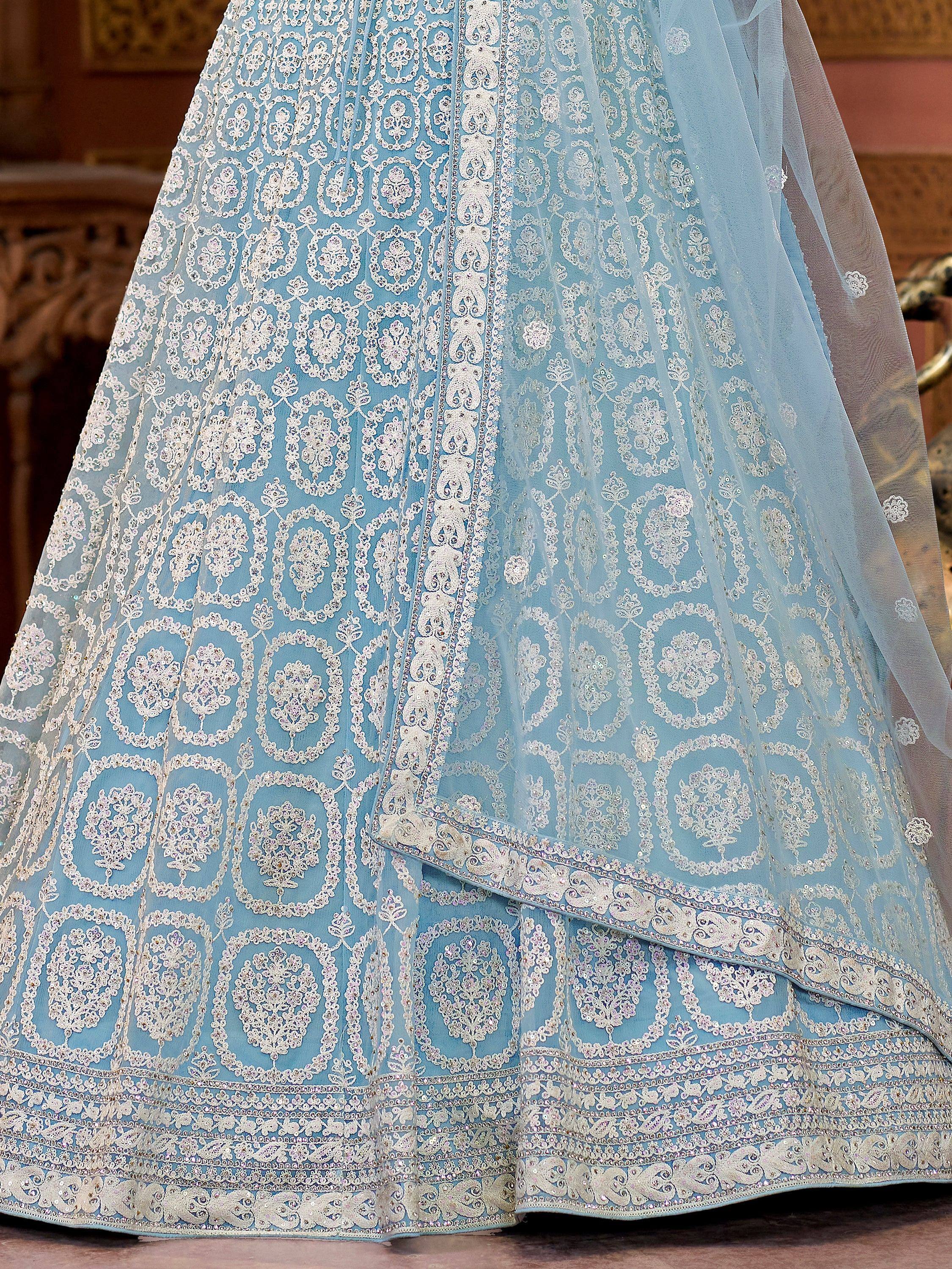 Light blue designer lehenga with intricate white embroidery and sequin detailing, perfect for Indian ethnic wear.