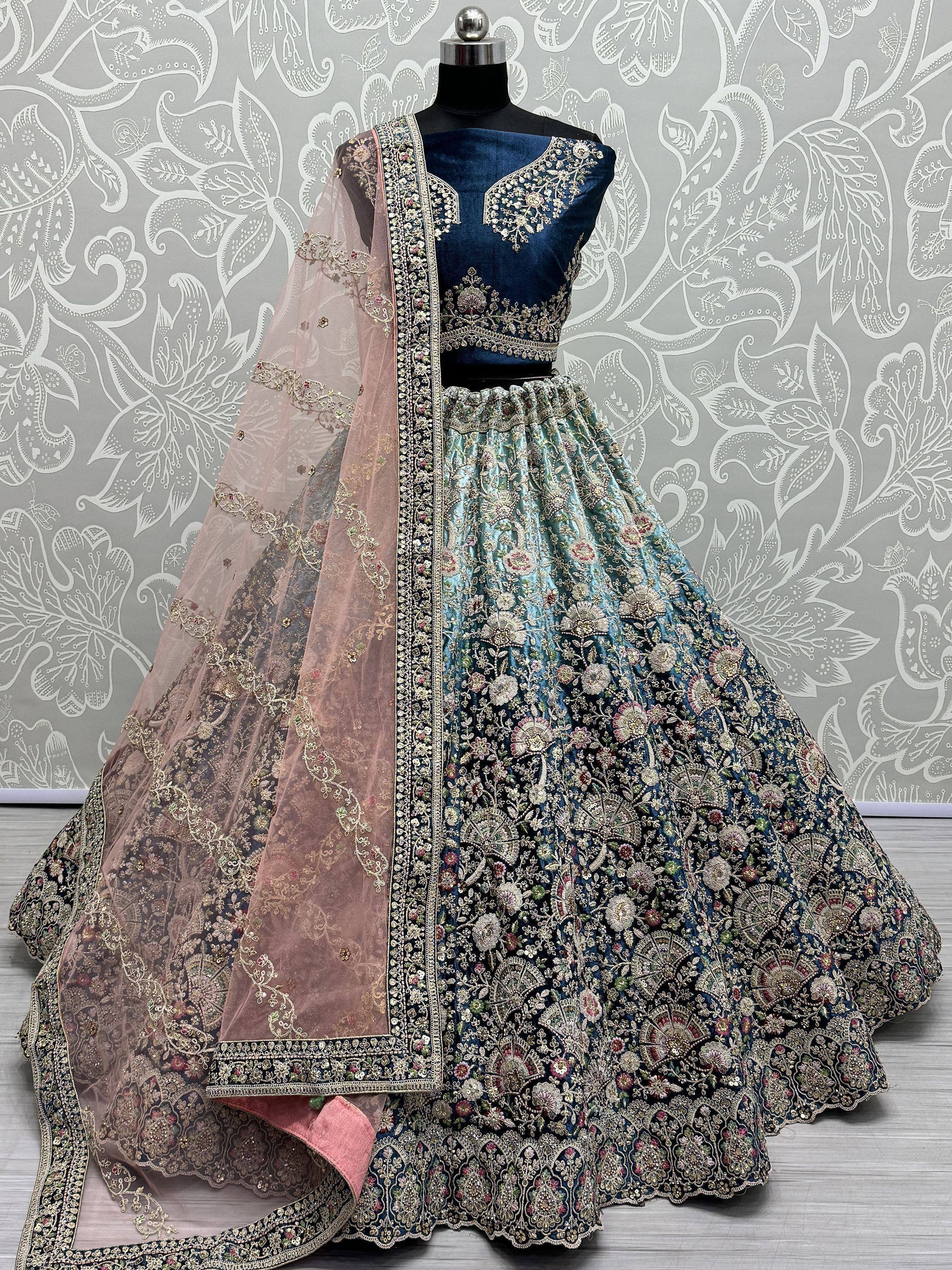 Elegant blue embroidered lehenga choli with floral motifs and sheer dupatta for Indian ethnic wear