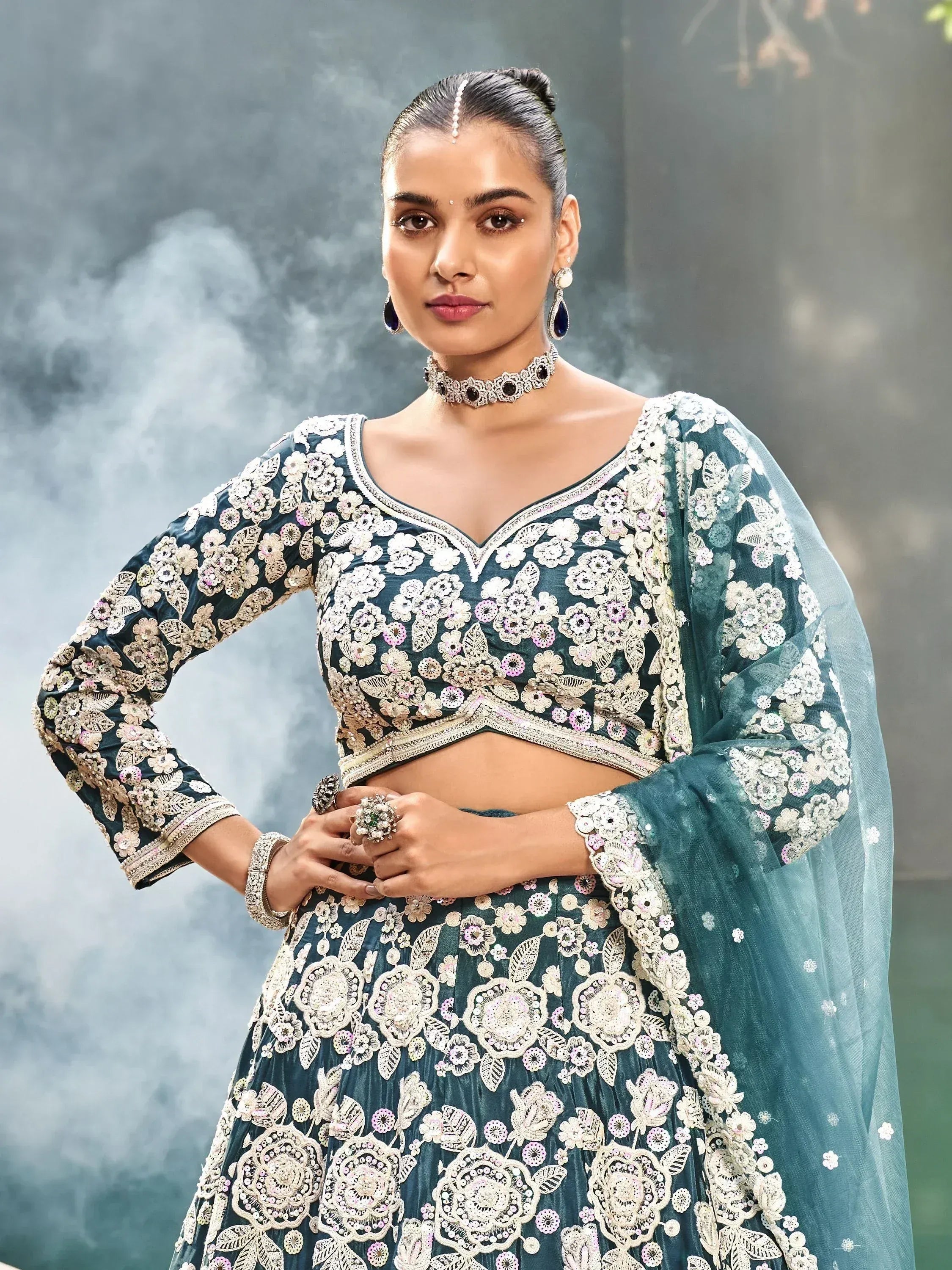 Teal floral embroidered lehenga choli with matching dupatta, perfect for Indian weddings and festive occasions.