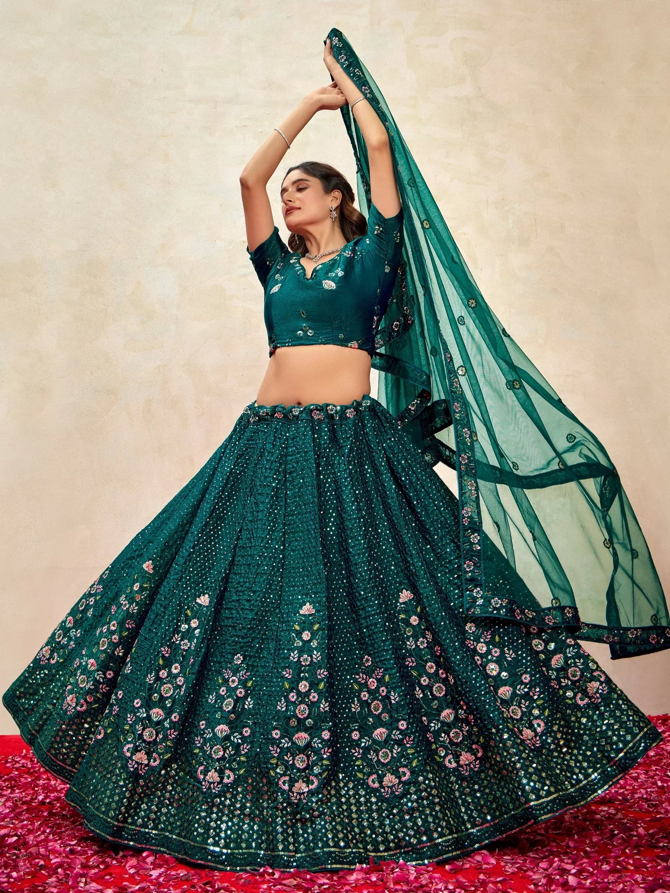 Emerald green designer lehenga choli with floral embroidery and sequins, perfect for Indian ethnic wear