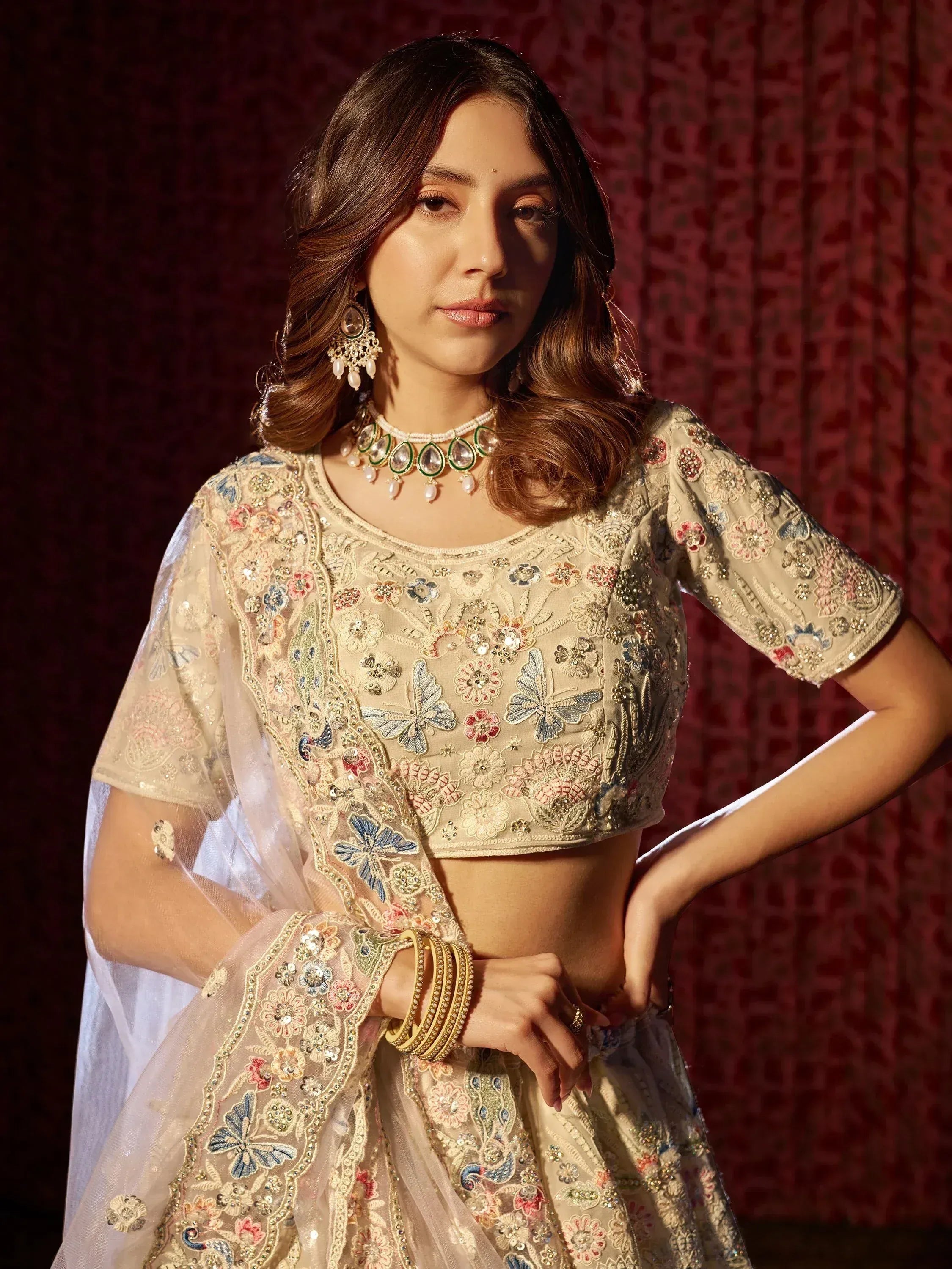 Elegant Indian ethnic lehenga choli with floral and butterfly embroidery, perfect for weddings and festivals.