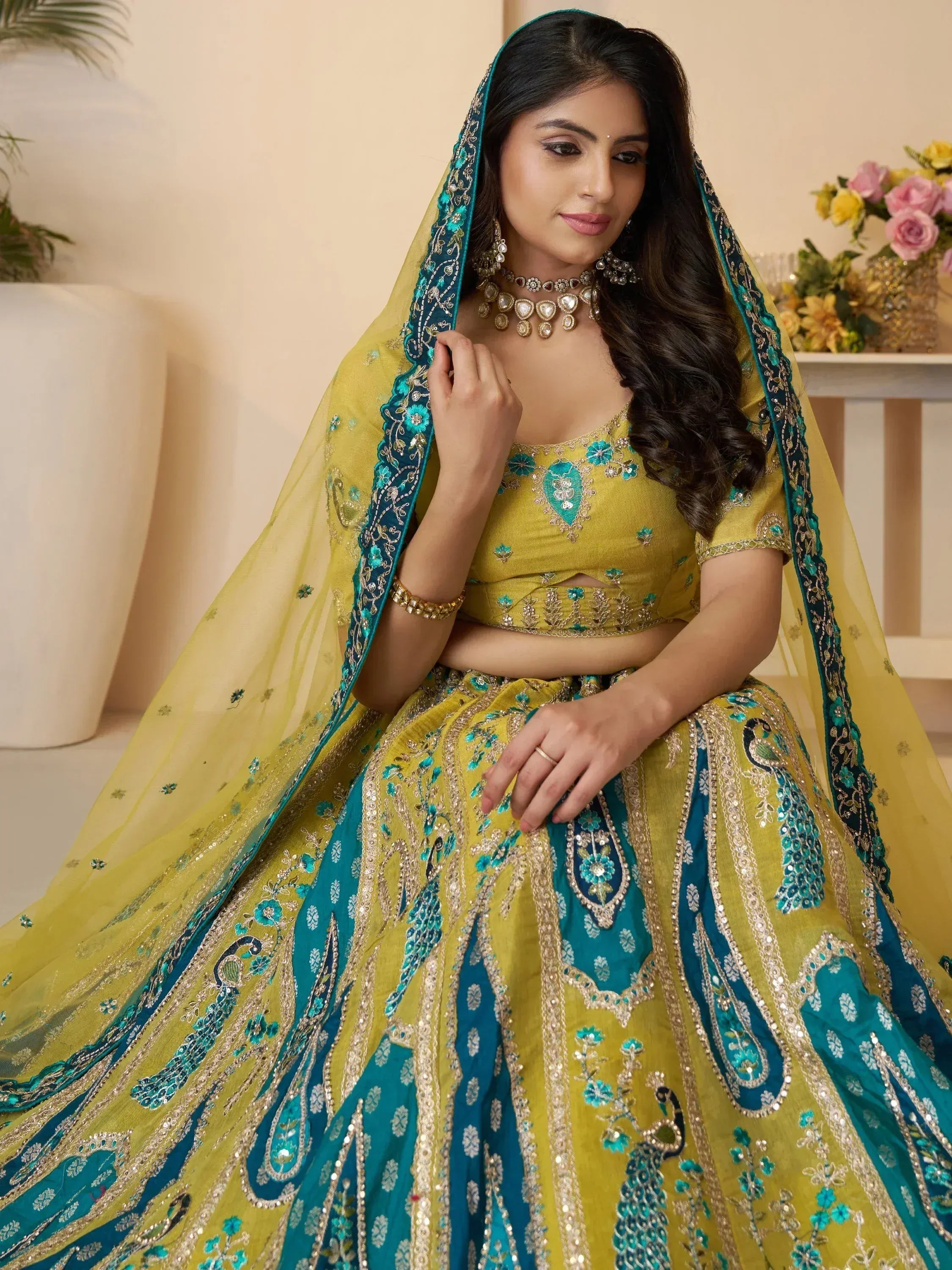 Yellow and teal designer lehenga choli with peacock embroidery and sequin work for Indian ethnic wear