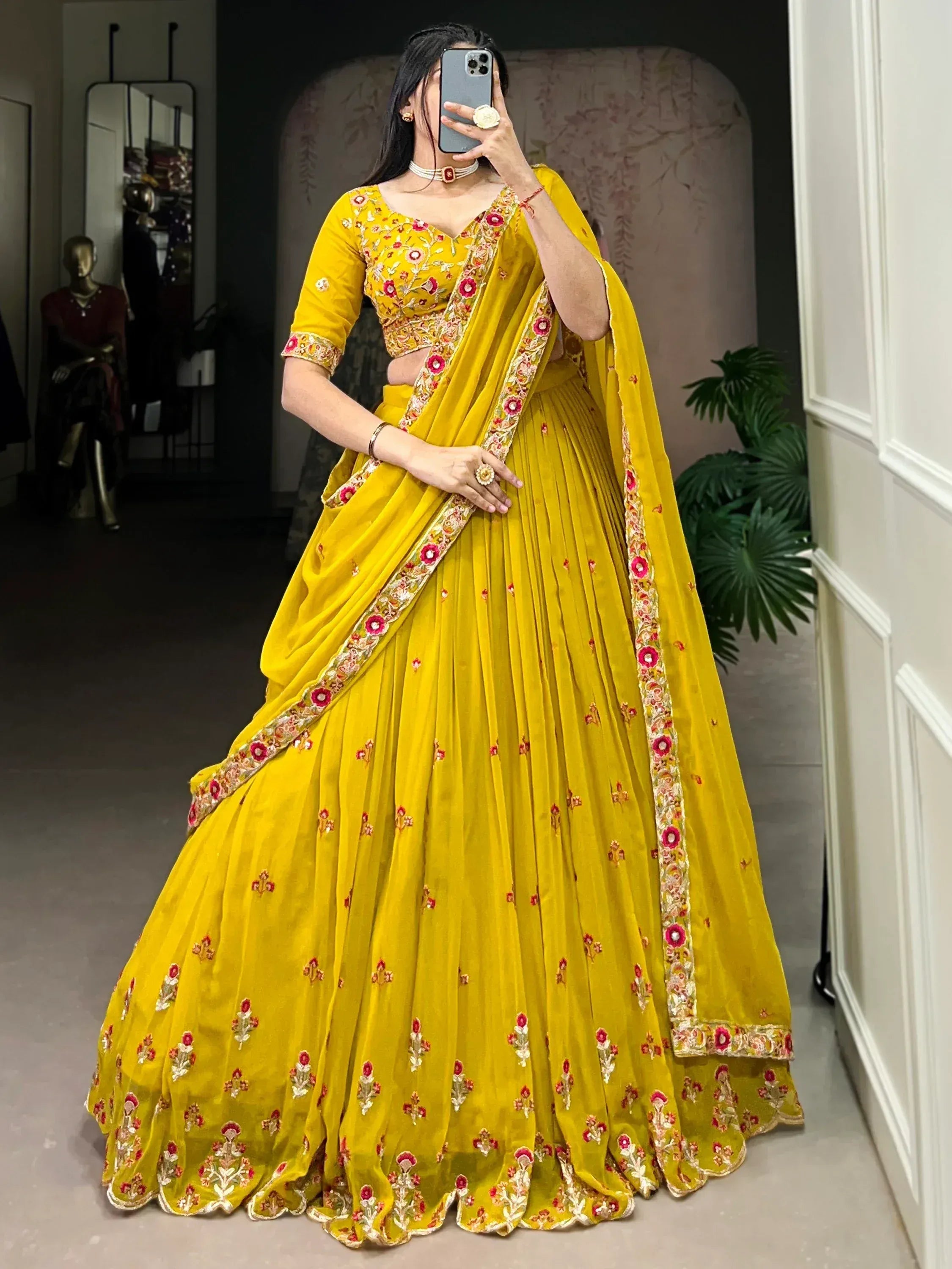 Yellow embroidered lehenga choli with floral detailing, perfect for Indian ethnic wear occasions