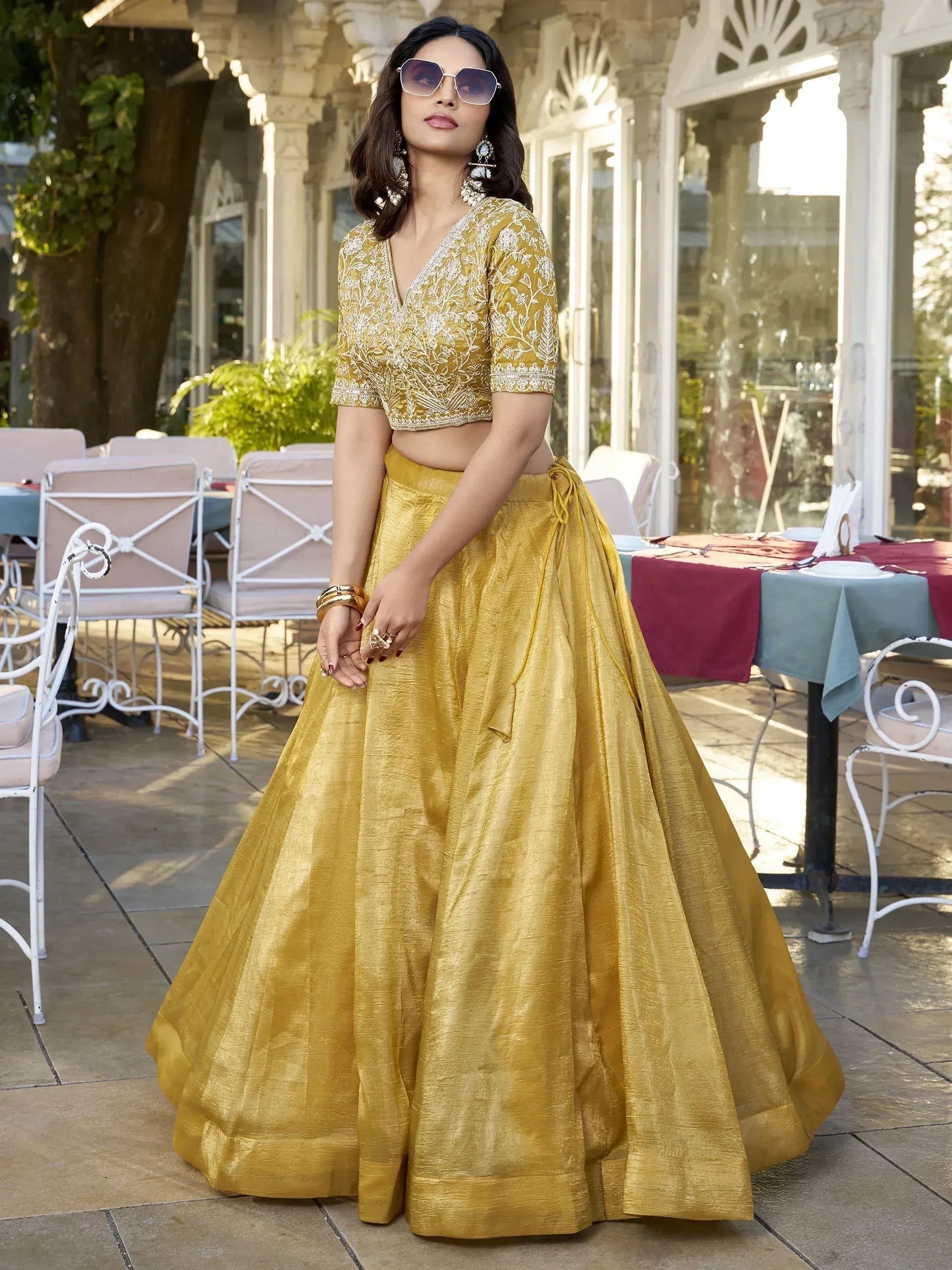 Mustard yellow embroidered lehenga choli with floral blouse, perfect for Indian ethnic wear events