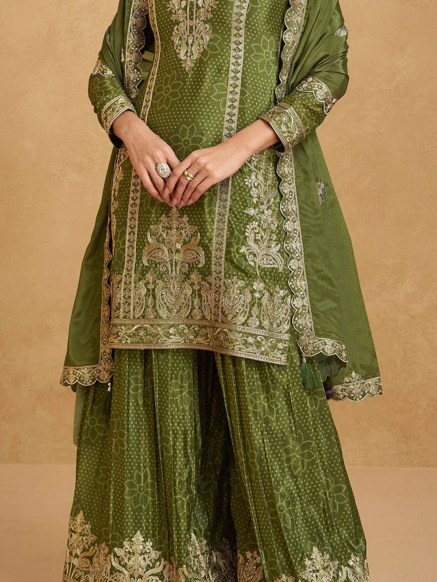 Olive green embroidered salwar kameez with gold detailing, perfect for ethnic occasions