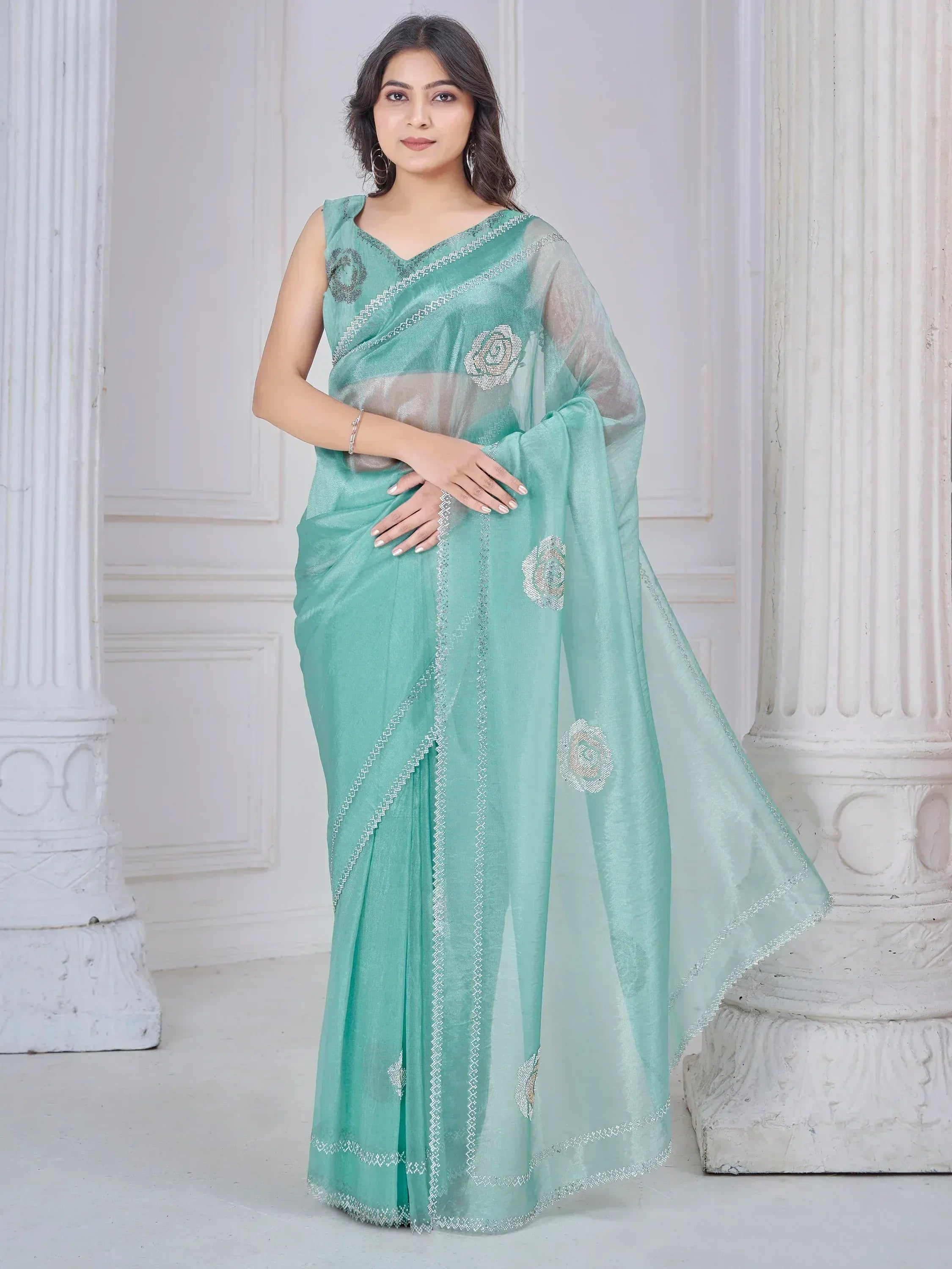 Mint green saree with floral embroidery and silver border, elegant Indian ethnic wear for women