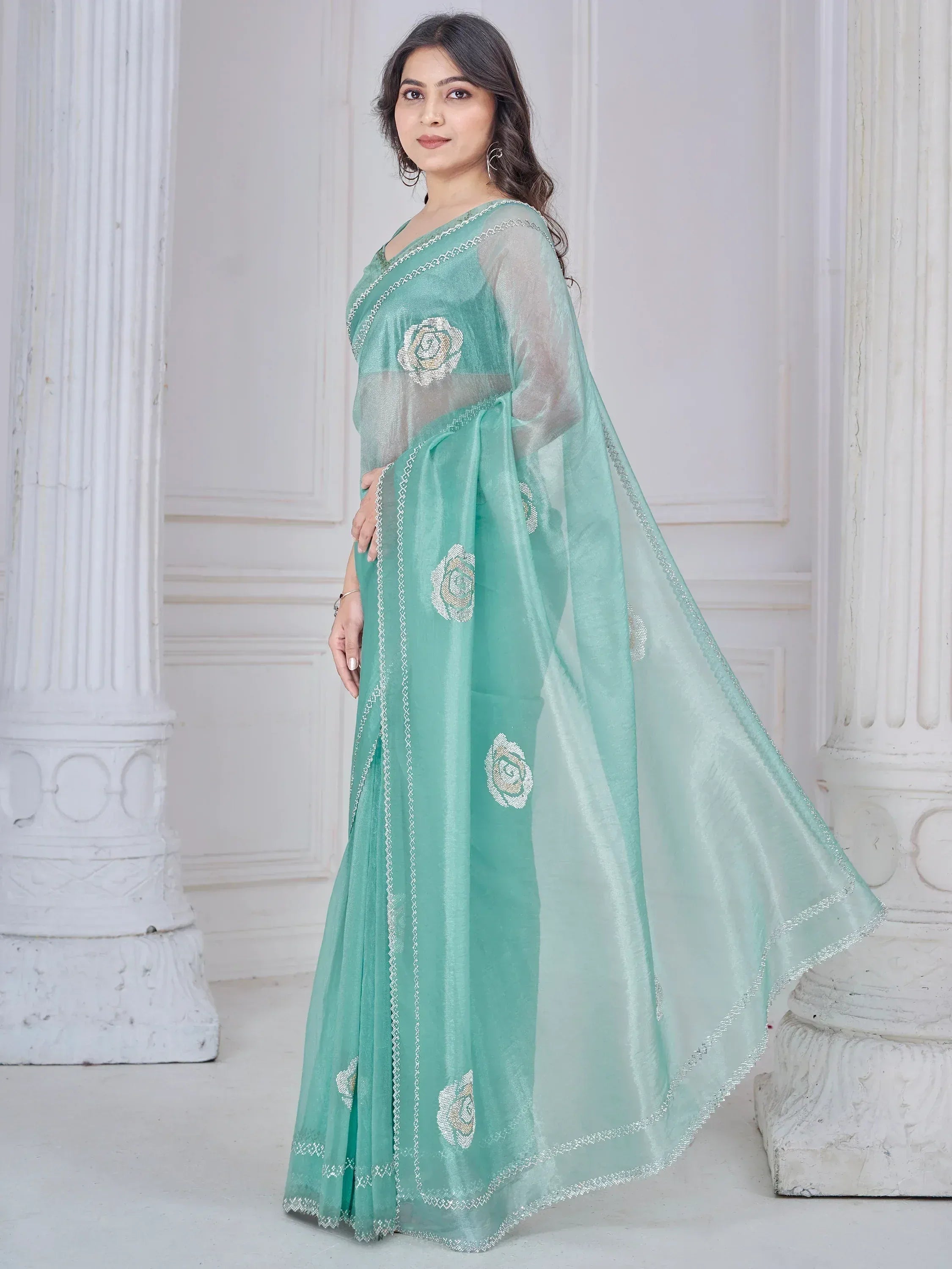 Mint green designer saree with floral embroidery and sheer blouse, elegant ethnic wear for women
