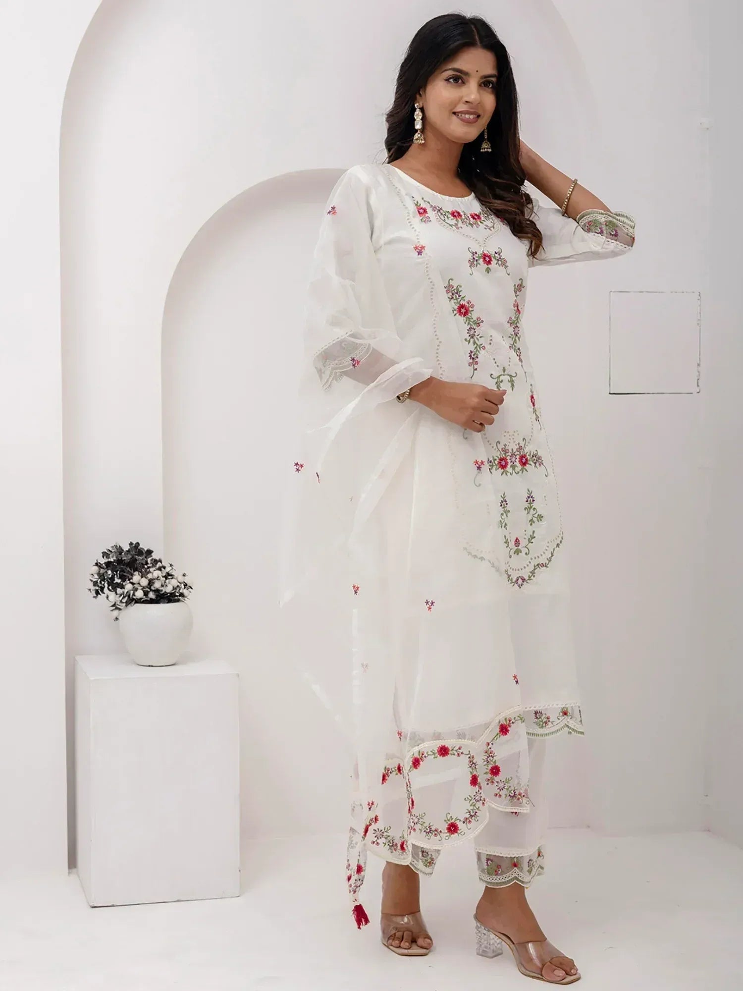 White embroidered salwar kameez with floral detailing, perfect for ethnic wear and festive occasions