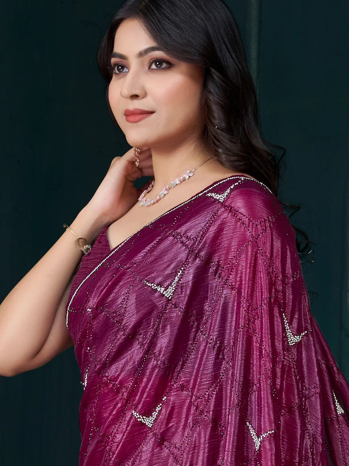 Woman in elegant maroon saree with diamond-like embellishments, perfect for Indian ethnic wear occasions