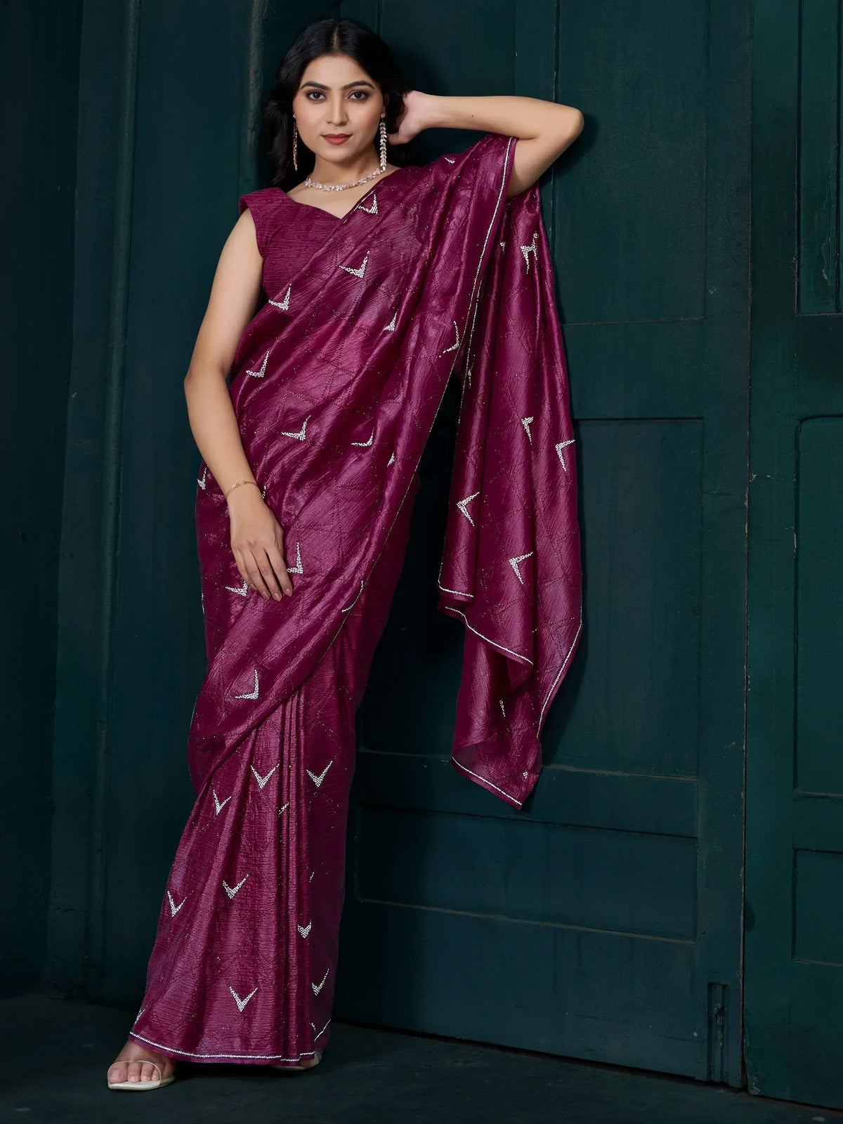 Woman in maroon ethnic saree with silver embroidery, perfect for Indian occasions and festive wear.