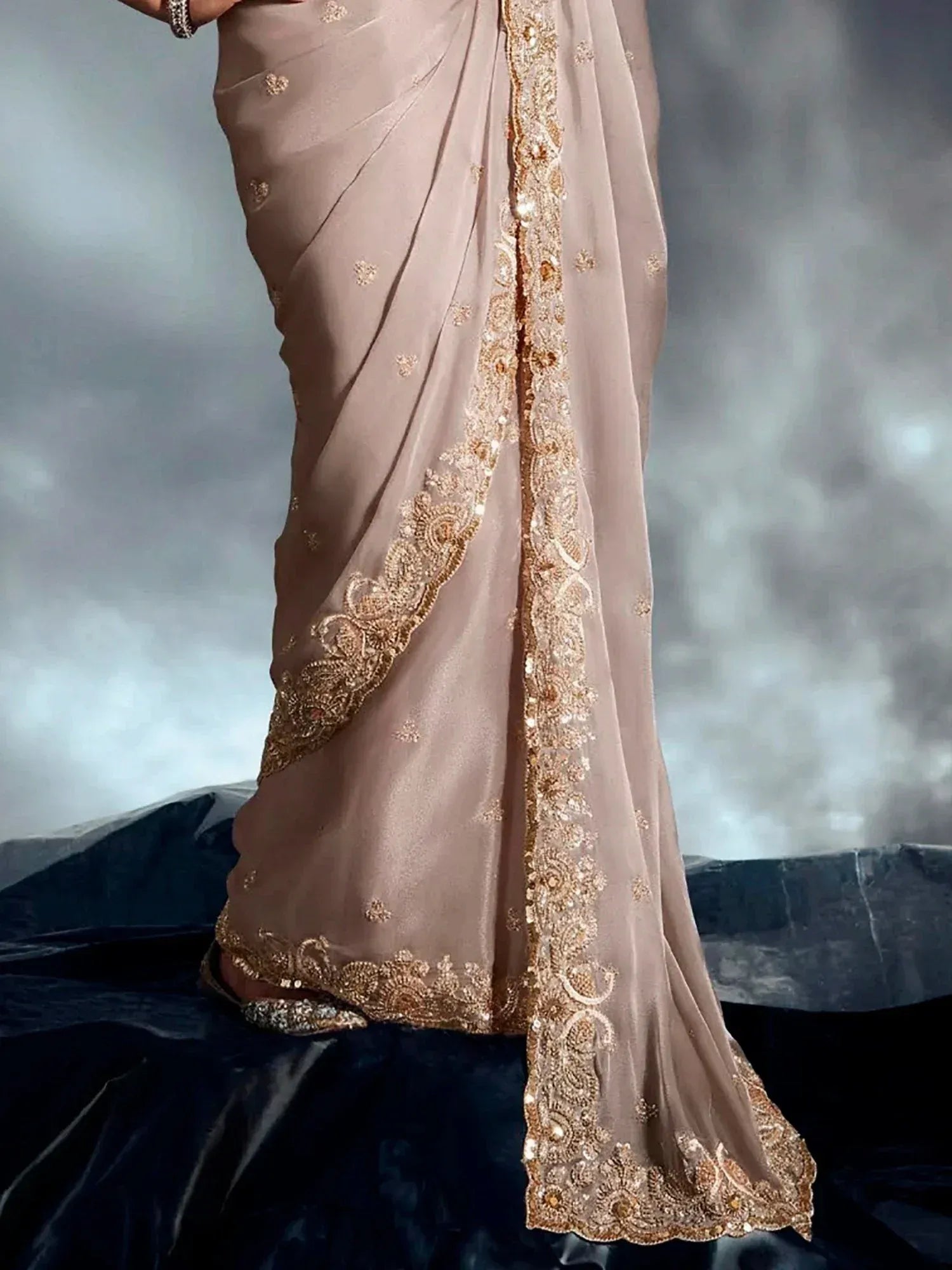 Elegant beige saree with gold embroidery and sequin border, perfect for Indian ethnic wear occasions