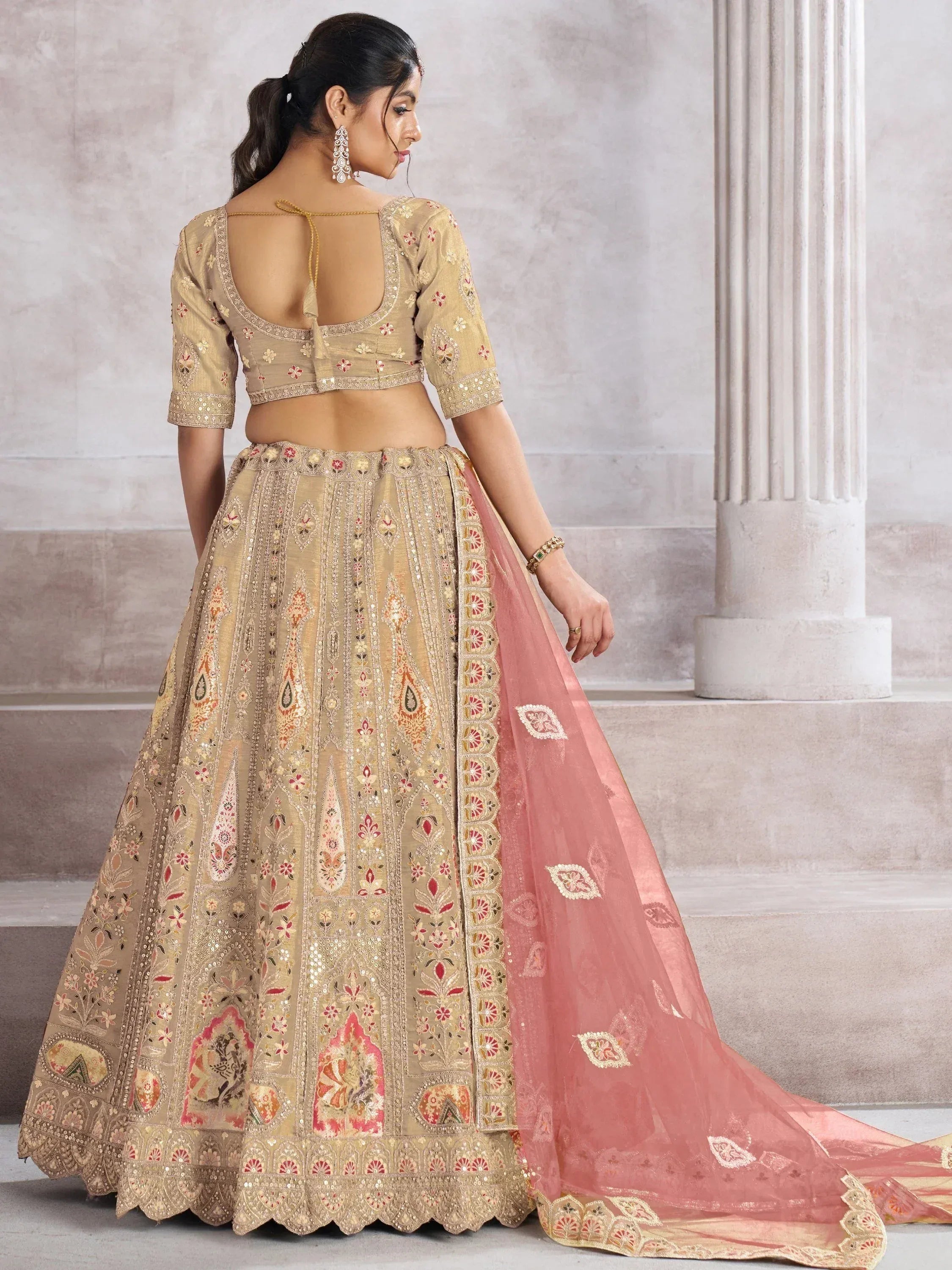 Beige embroidered lehenga choli with pink dupatta, designer Indian ethnic wear for weddings