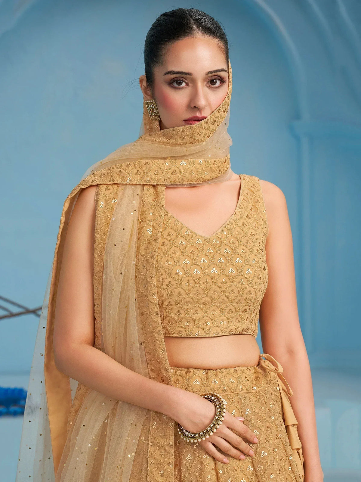 Golden embroidered lehenga choli with matching dupatta, perfect for Indian ethnic wear occasions