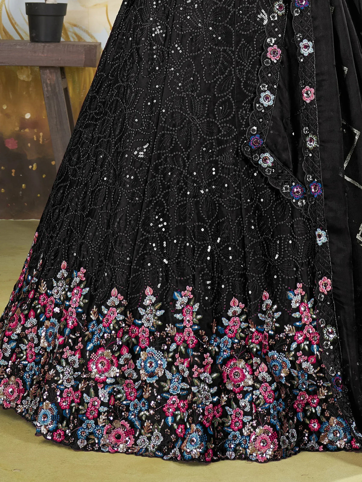 Black floral embroidered lehenga with sequin detailing, perfect for Indian ethnic wear occasions.