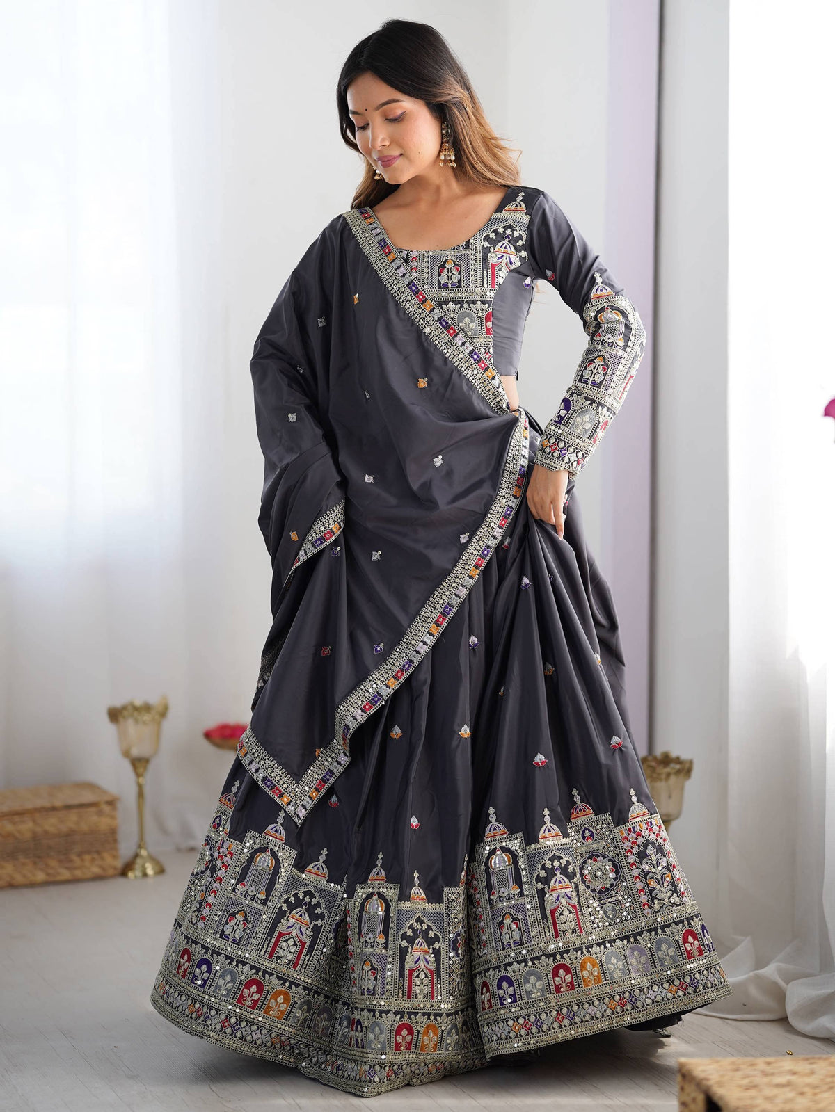 Grey designer lehenga choli with intricate temple embroidery and mirror work for Indian ethnic wear