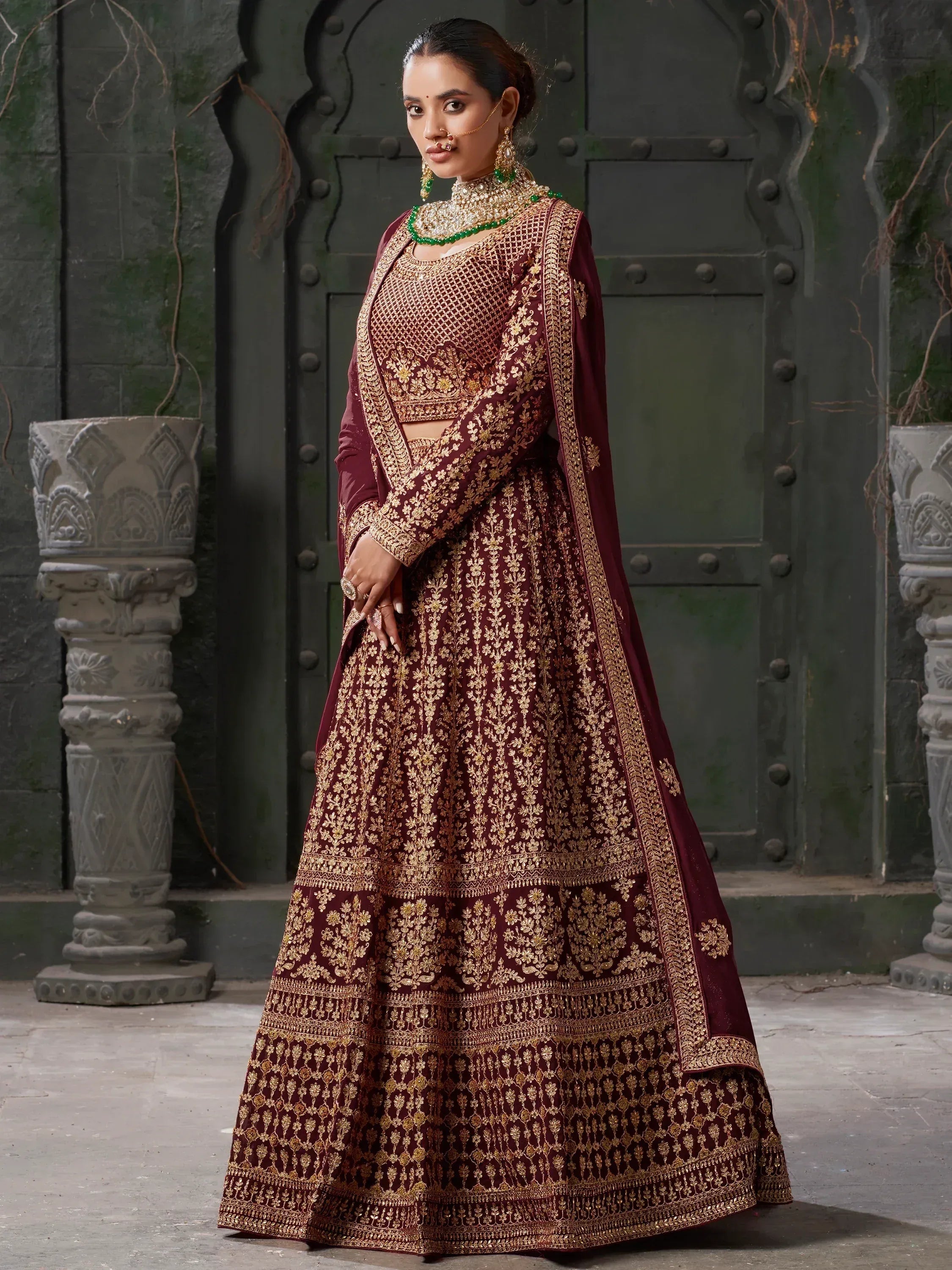 Maroon designer lehenga choli with gold embroidery, perfect for Indian weddings and ethnic events