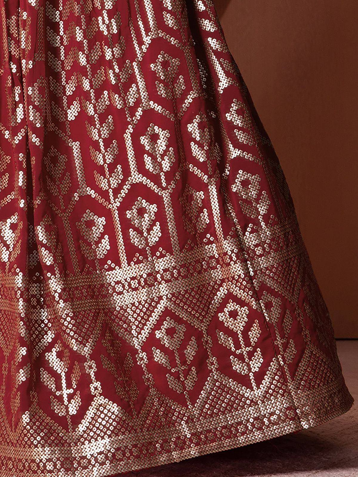 Rich maroon lehenga with intricate gold floral embroidery, perfect for Indian ethnic wear occasions.