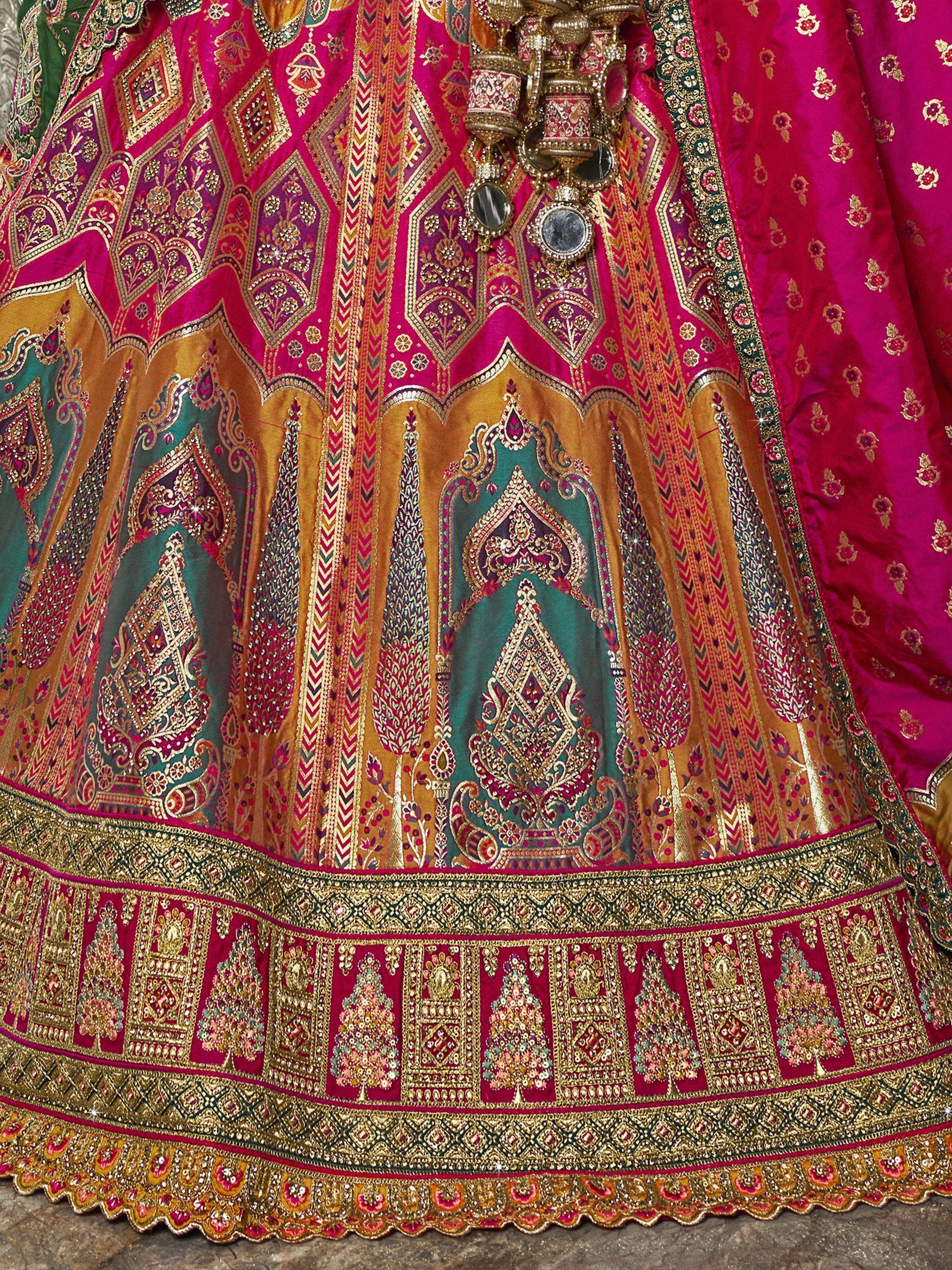 Luxury pink and gold embroidered lehenga with intricate mirror work and heavy border detailing