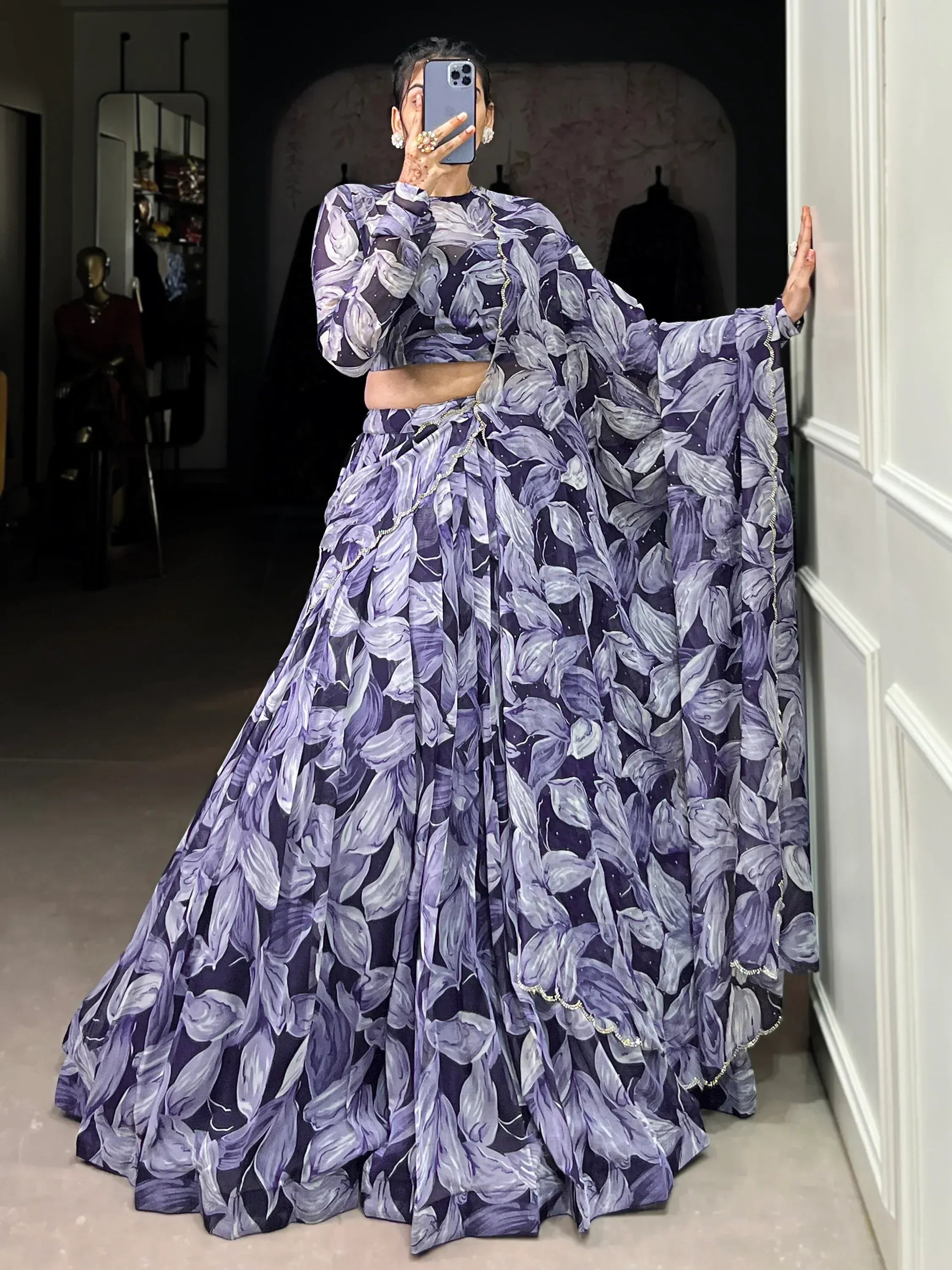 Purple floral lehenga choli with sheer sleeves and embellished border, perfect for Indian ethnic occasions
