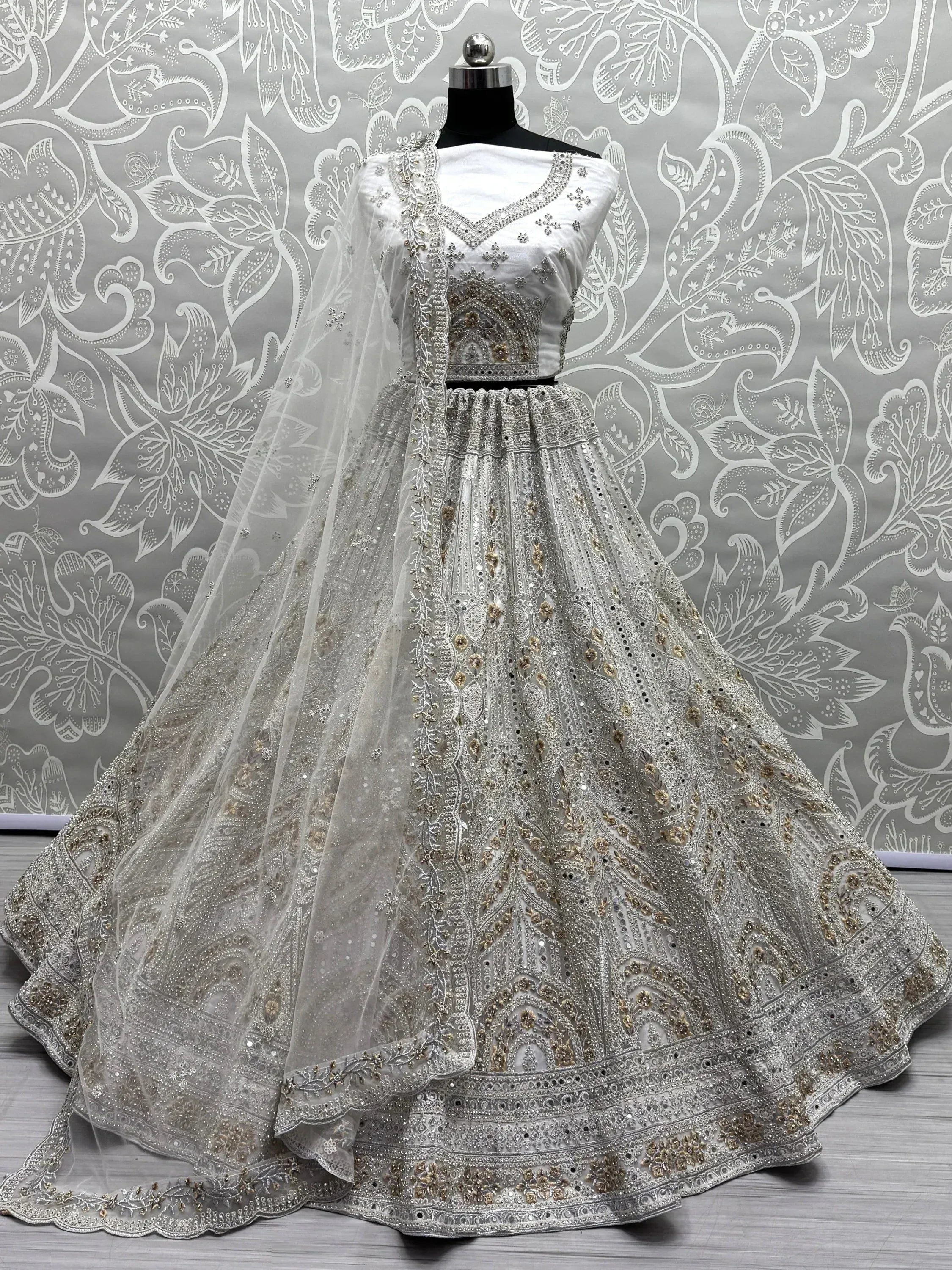 White designer lehenga choli with heavy embroidery and dupatta, ethnic Indian wear for weddings