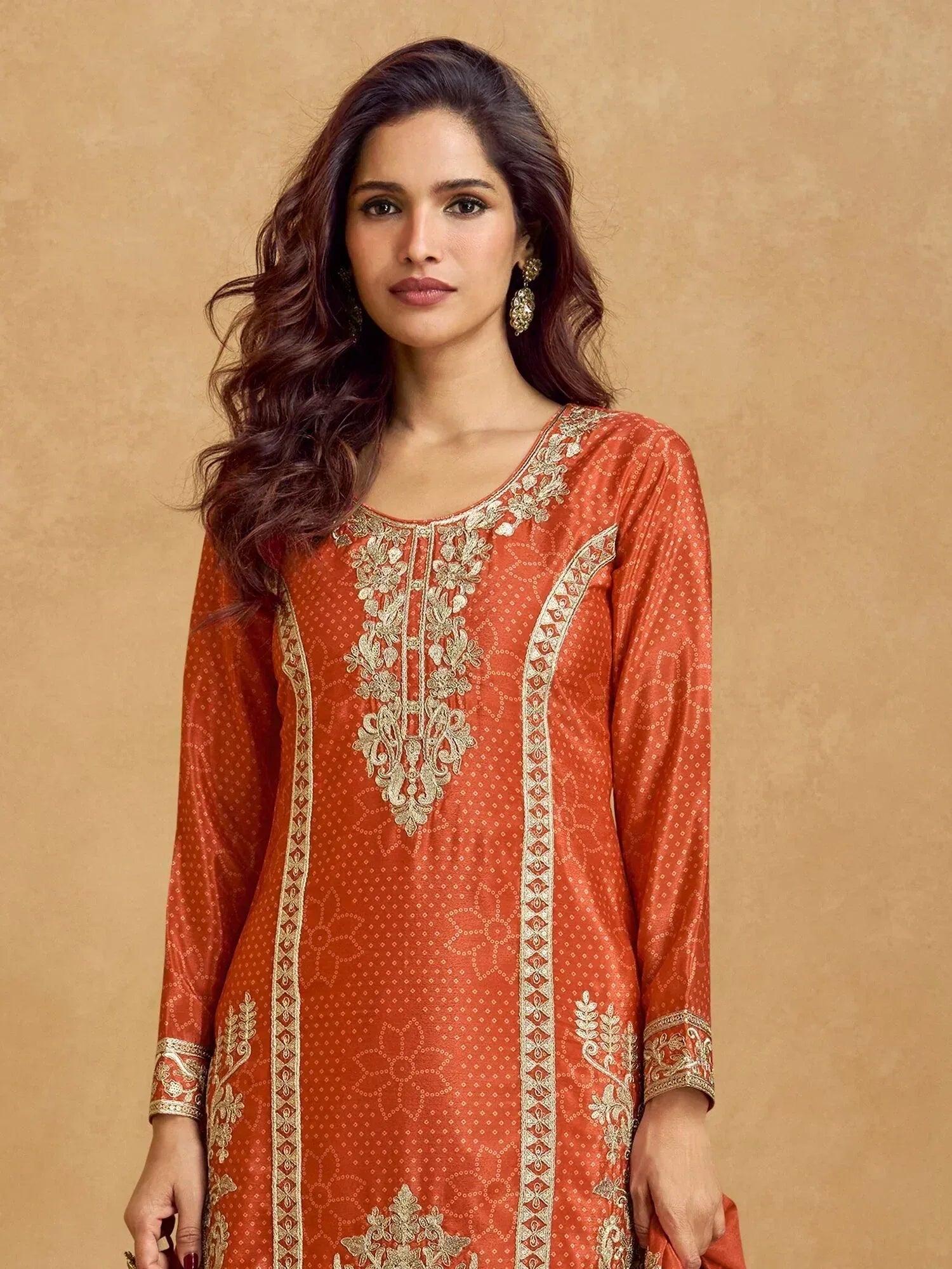 Orange embroidered ethnic kurti with gold detailing, perfect for Indian wear and festive occasions
