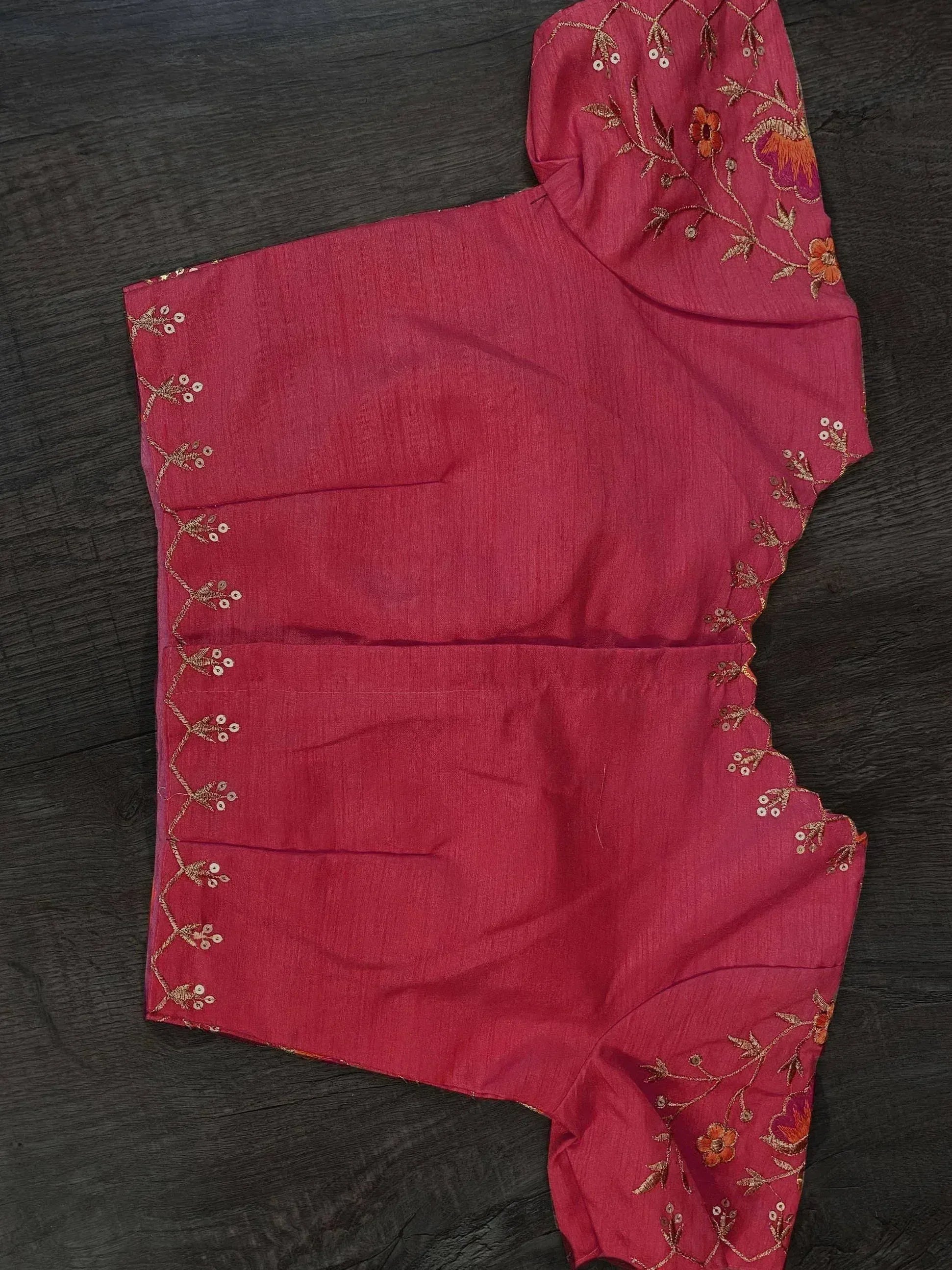 Pink ethnic blouse with floral embroidery and gold thread detailing, perfect for Indian wear