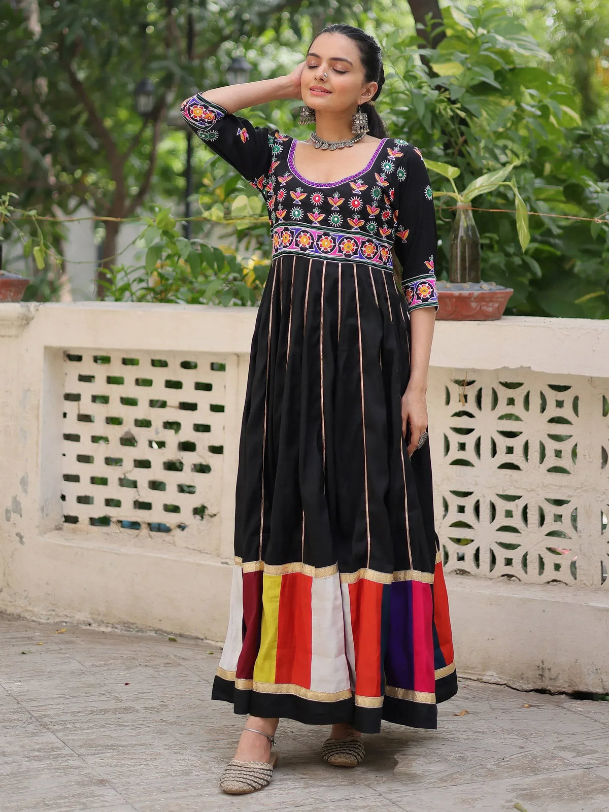 Black embroidered ethnic gown with colorful patchwork hem, perfect for Indian festive wear