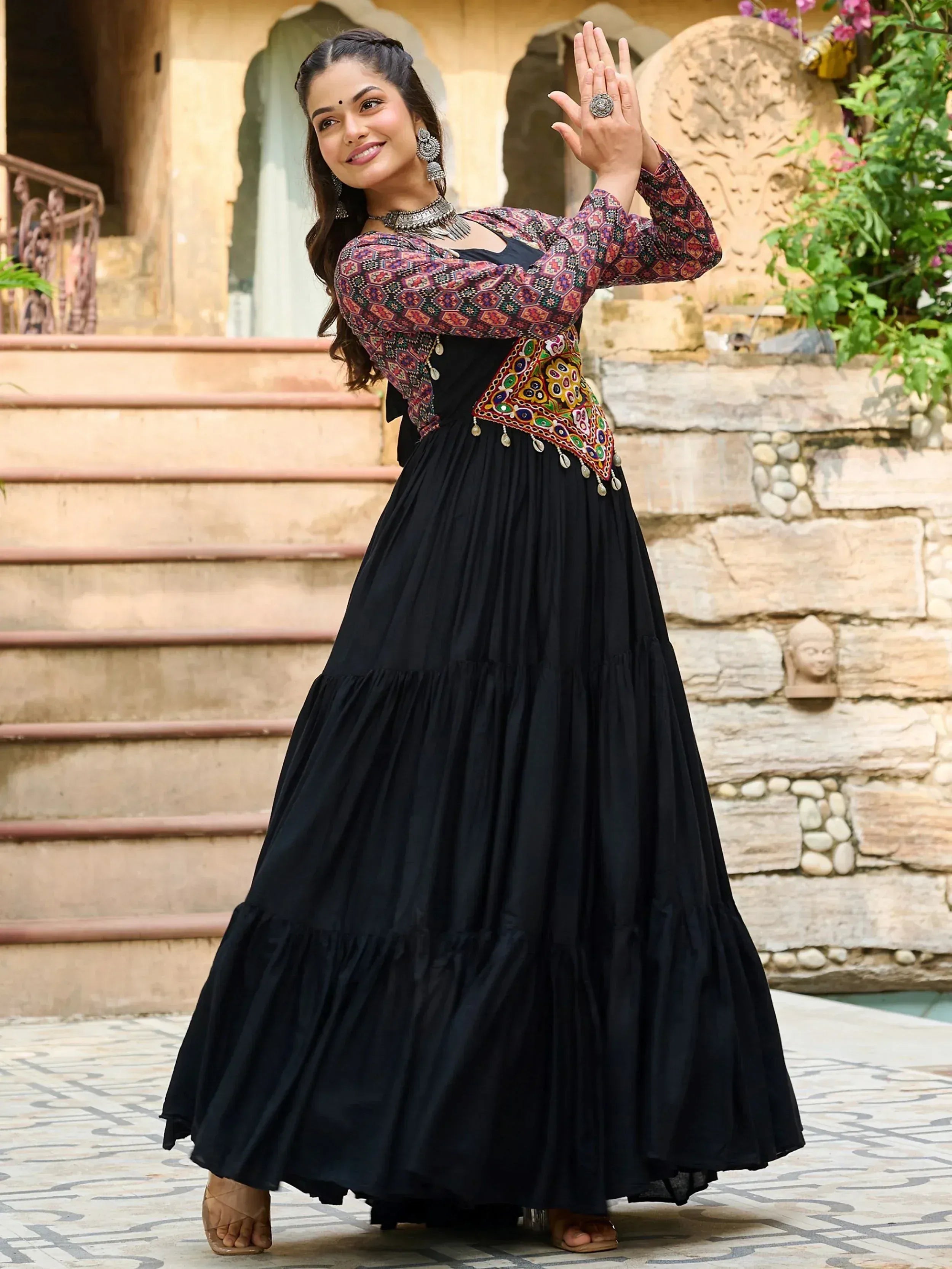 Black ethnic gown with colorful embroidery and mirror work, perfect for Indian festive wear
