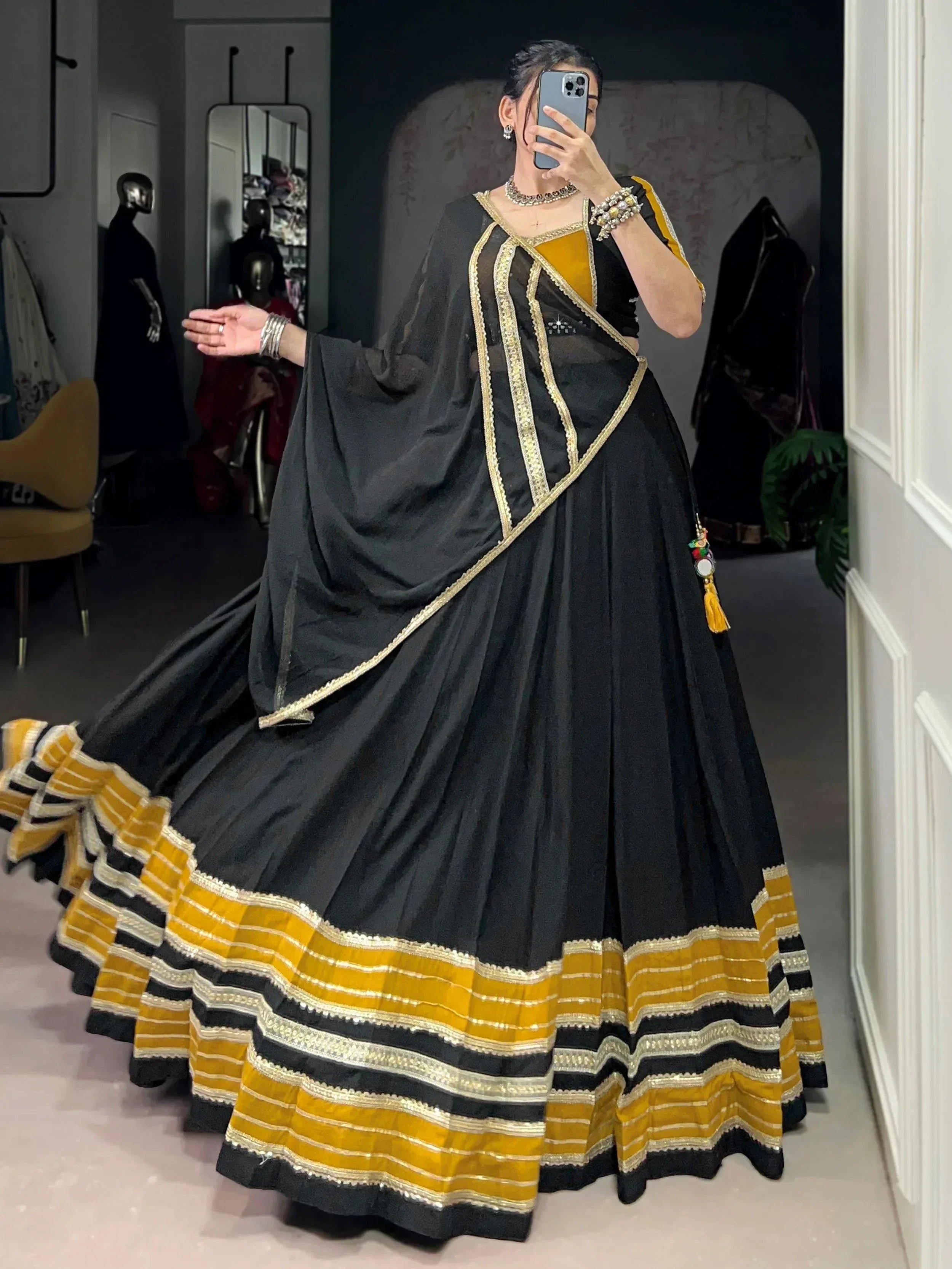 Black and mustard yellow designer lehenga choli with gold embroidery, perfect for Indian ethnic wear