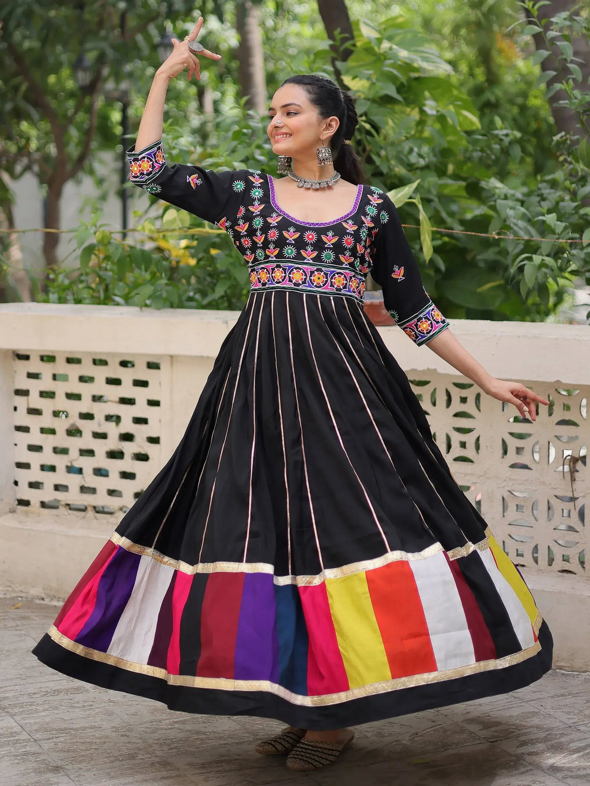 Black embroidered ethnic anarkali with colorful panel skirt, perfect for festive occasions