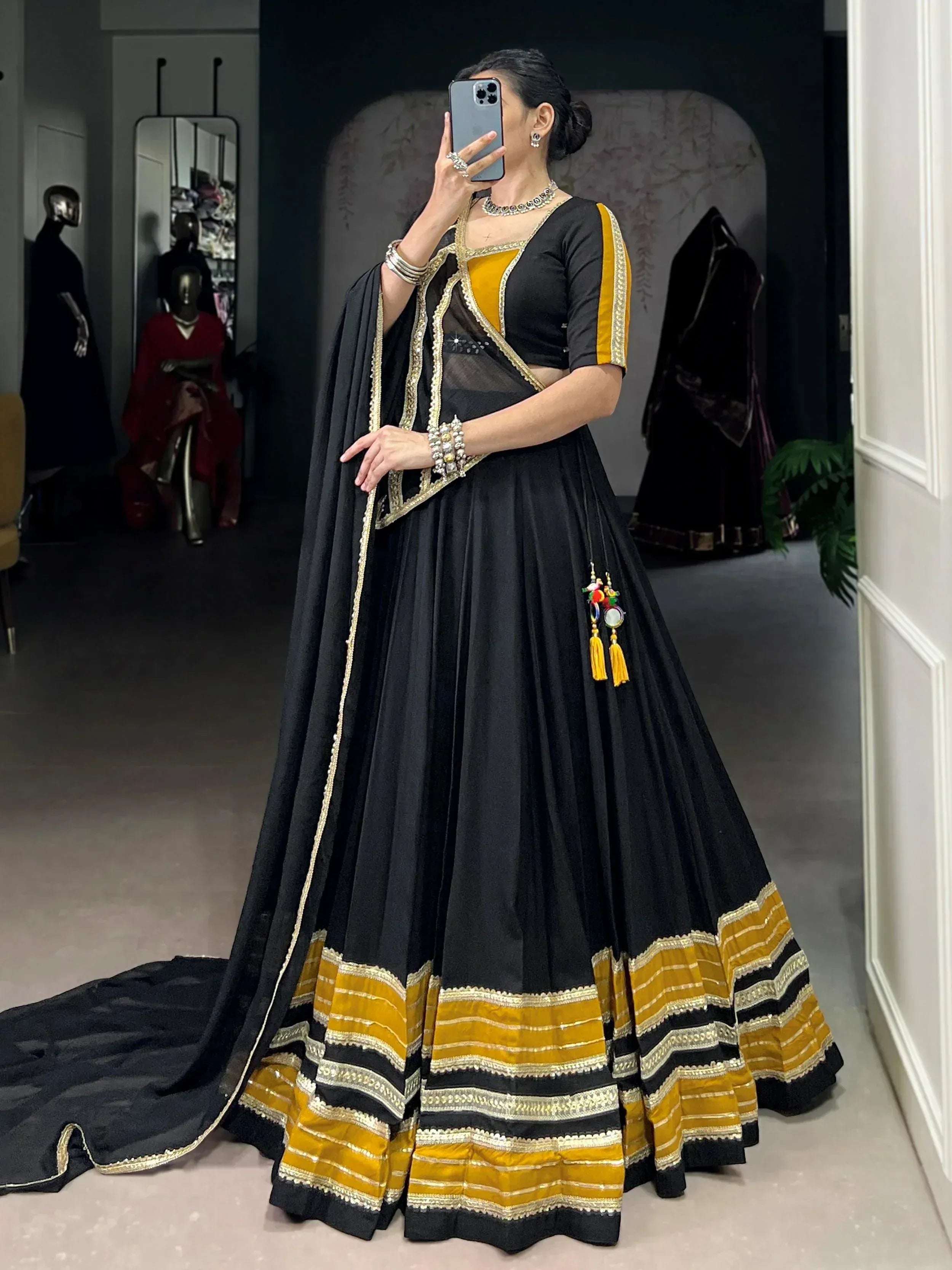 Black and mustard Indian lehenga choli with gold embroidery, perfect for ethnic wear and festive occasions.