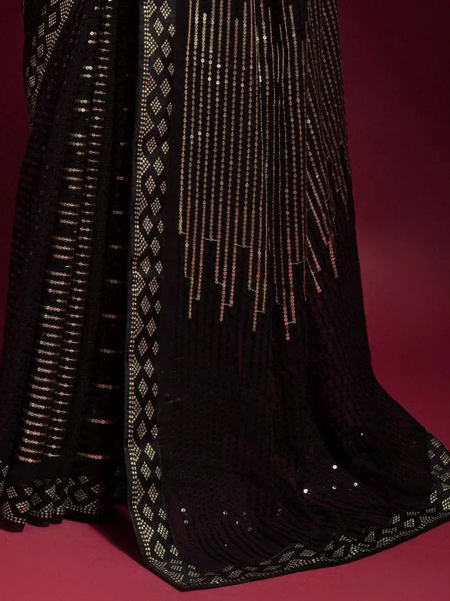 Black ethnic gown with gold sequin fringe and diamond patterns, elegant Indian party wear