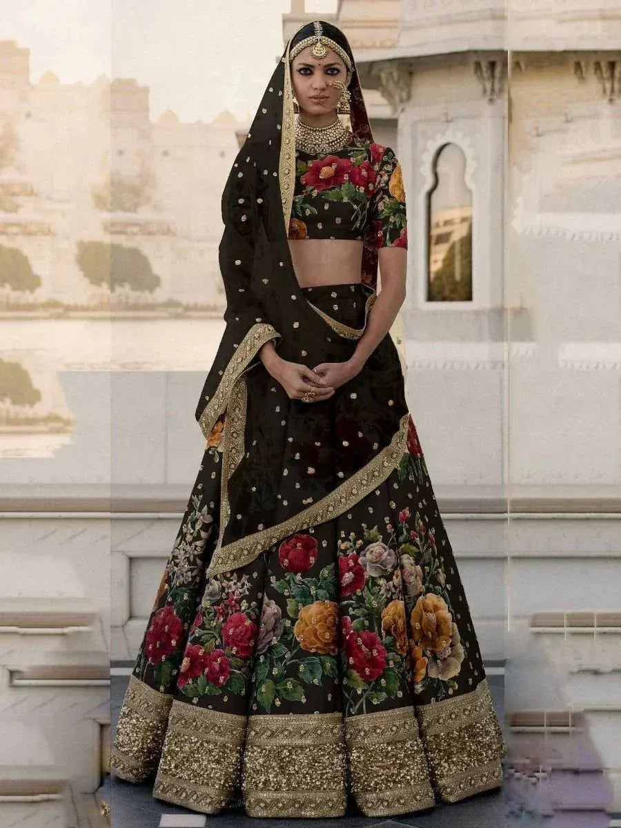 Black floral lehenga choli with gold embroidery, perfect for Indian weddings and ethnic events.
