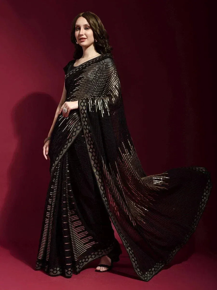 Elegant black saree with gold sequin detailing, perfect for Indian ethnic wear occasions