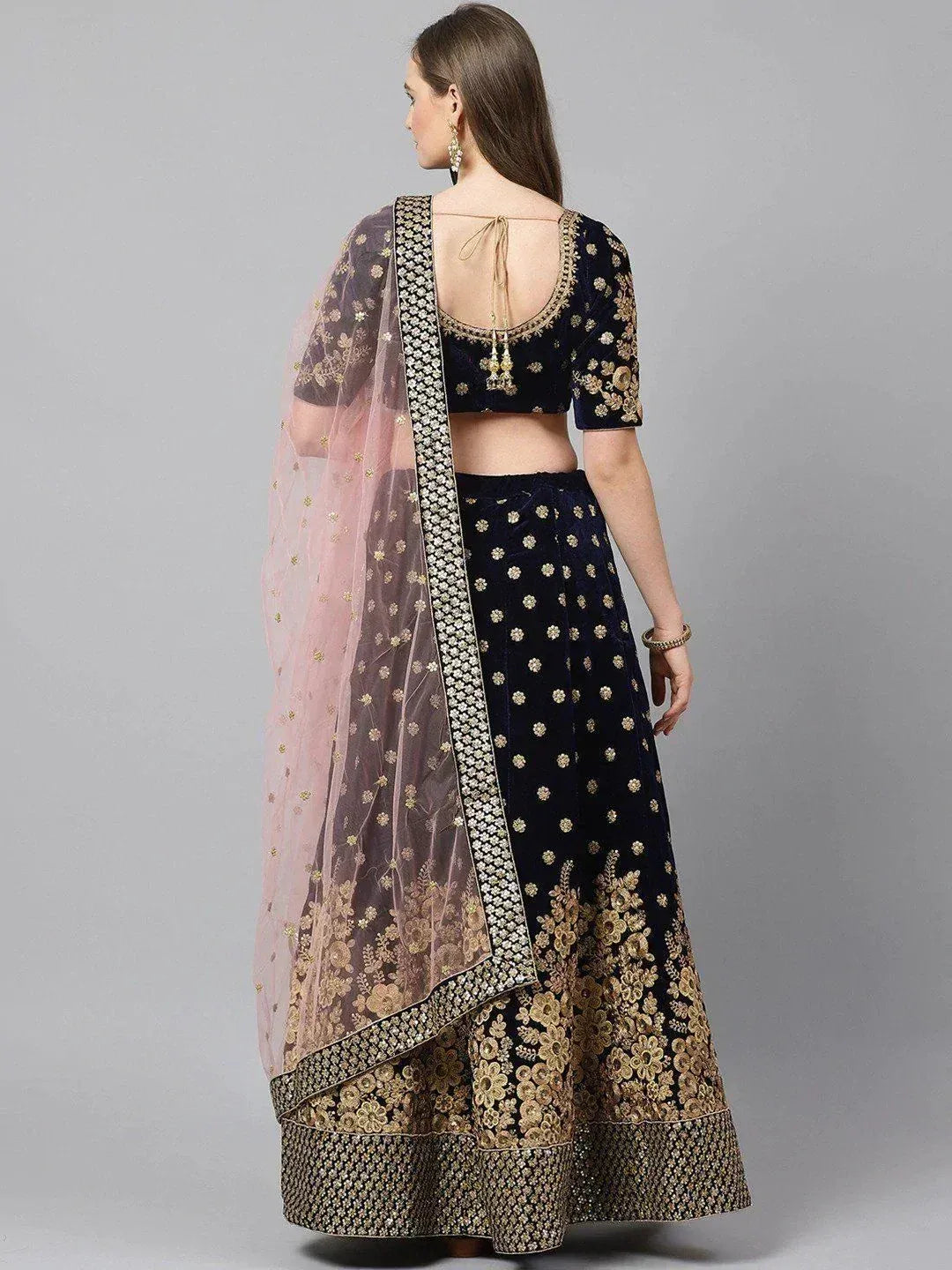 Navy blue velvet lehenga choli with gold embroidery and pink dupatta, ethnic Indian wear