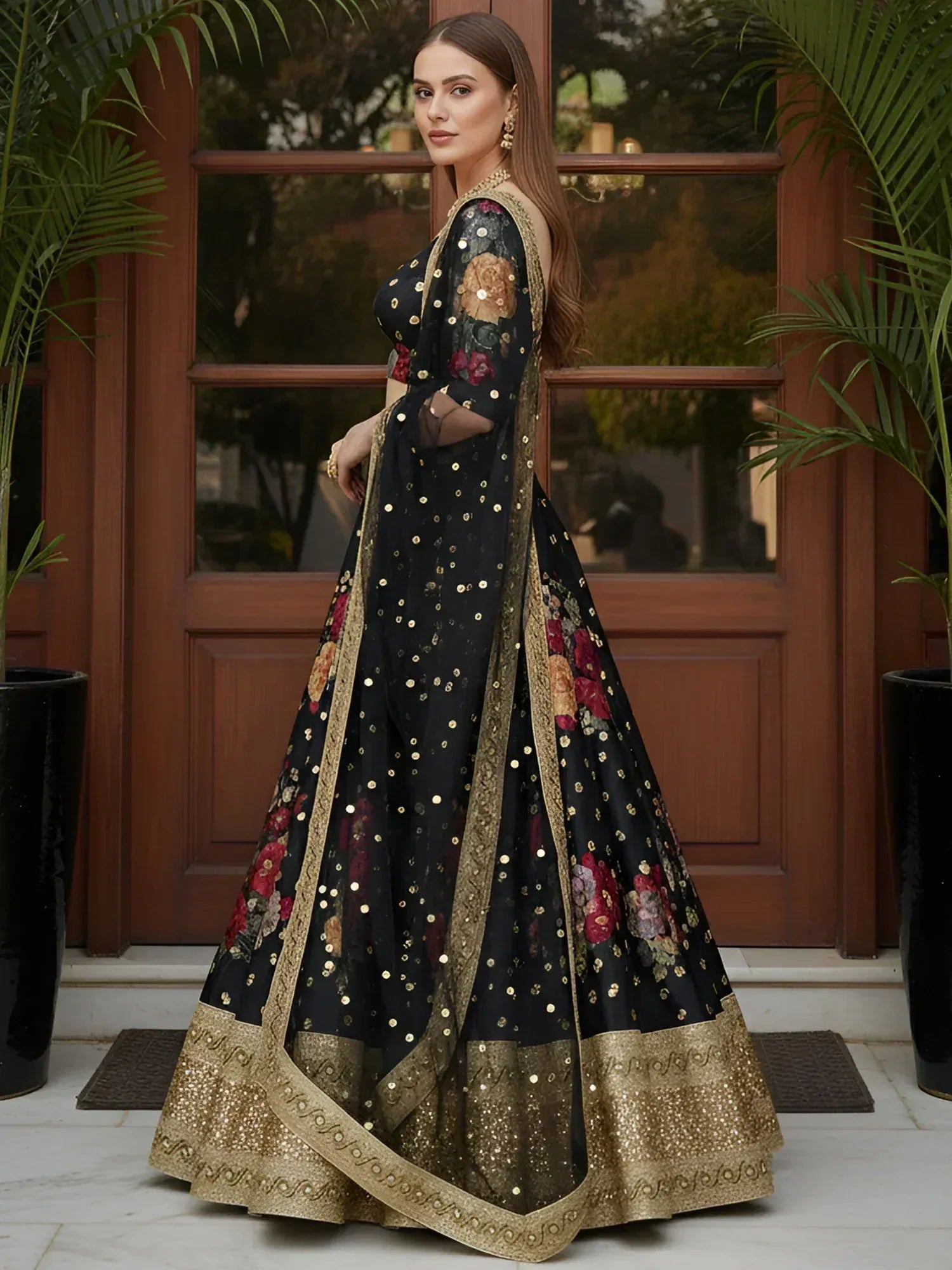 Black floral embroidered lehenga choli with gold sequins and border, perfect for Indian ethnic occasions