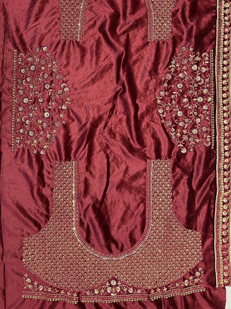 Maroon velvet salwar kameez with gold floral embroidery and detailed neckline design