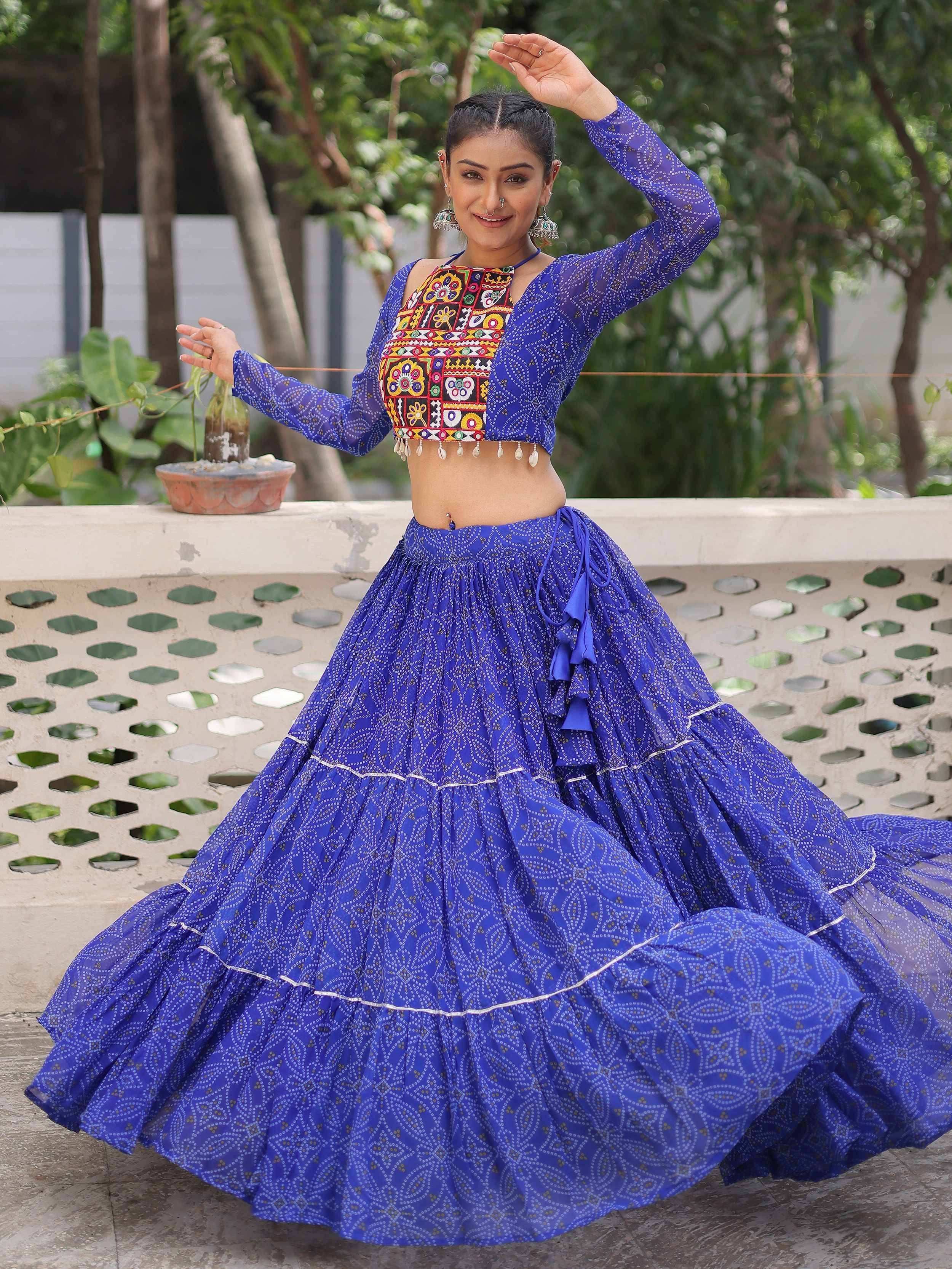 Blue ethnic lehenga choli with embroidered crop top and flared skirt for festive occasions