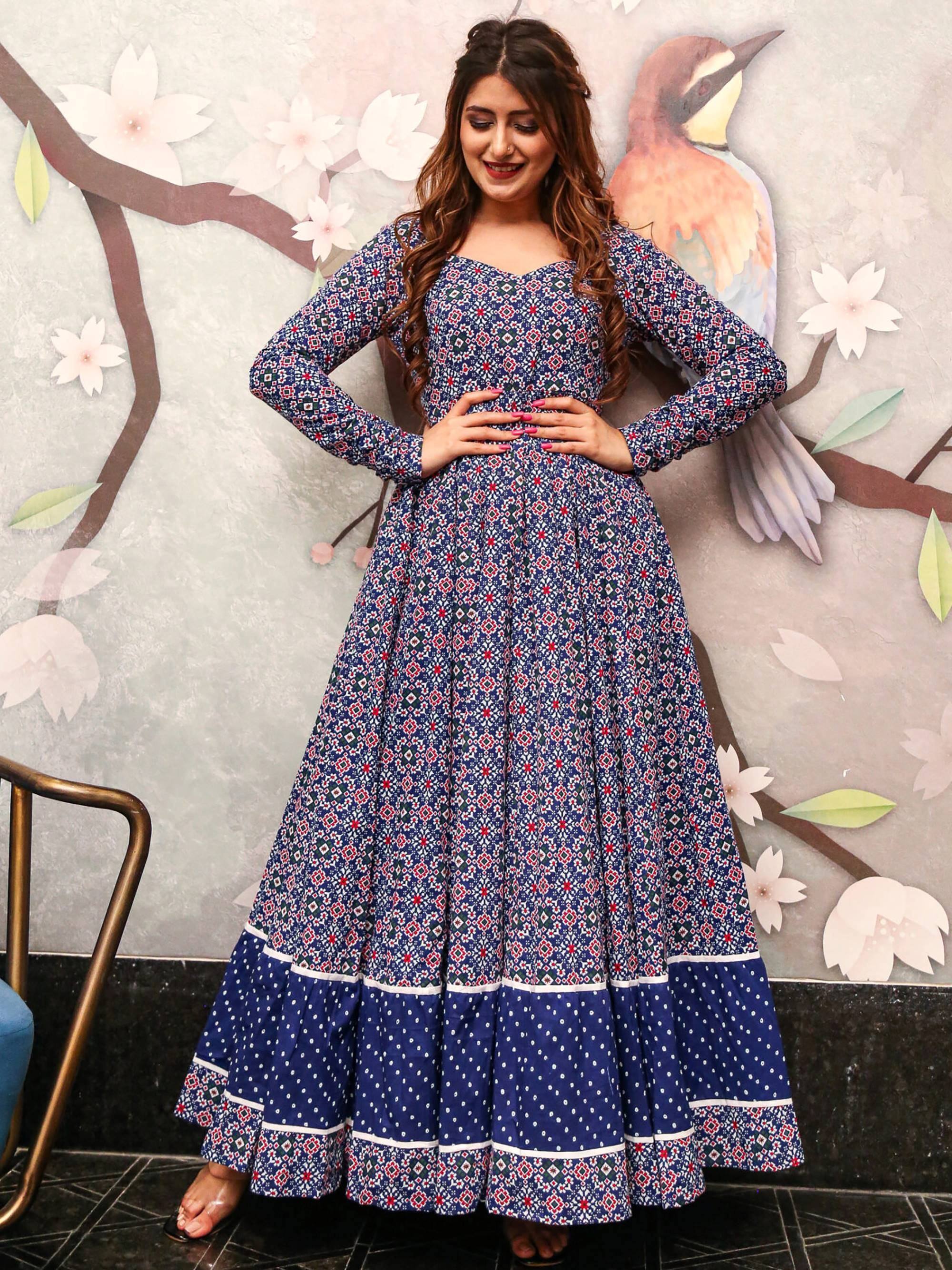 Blue printed ethnic gown with flared skirt, long sleeves, and geometric patterns for women