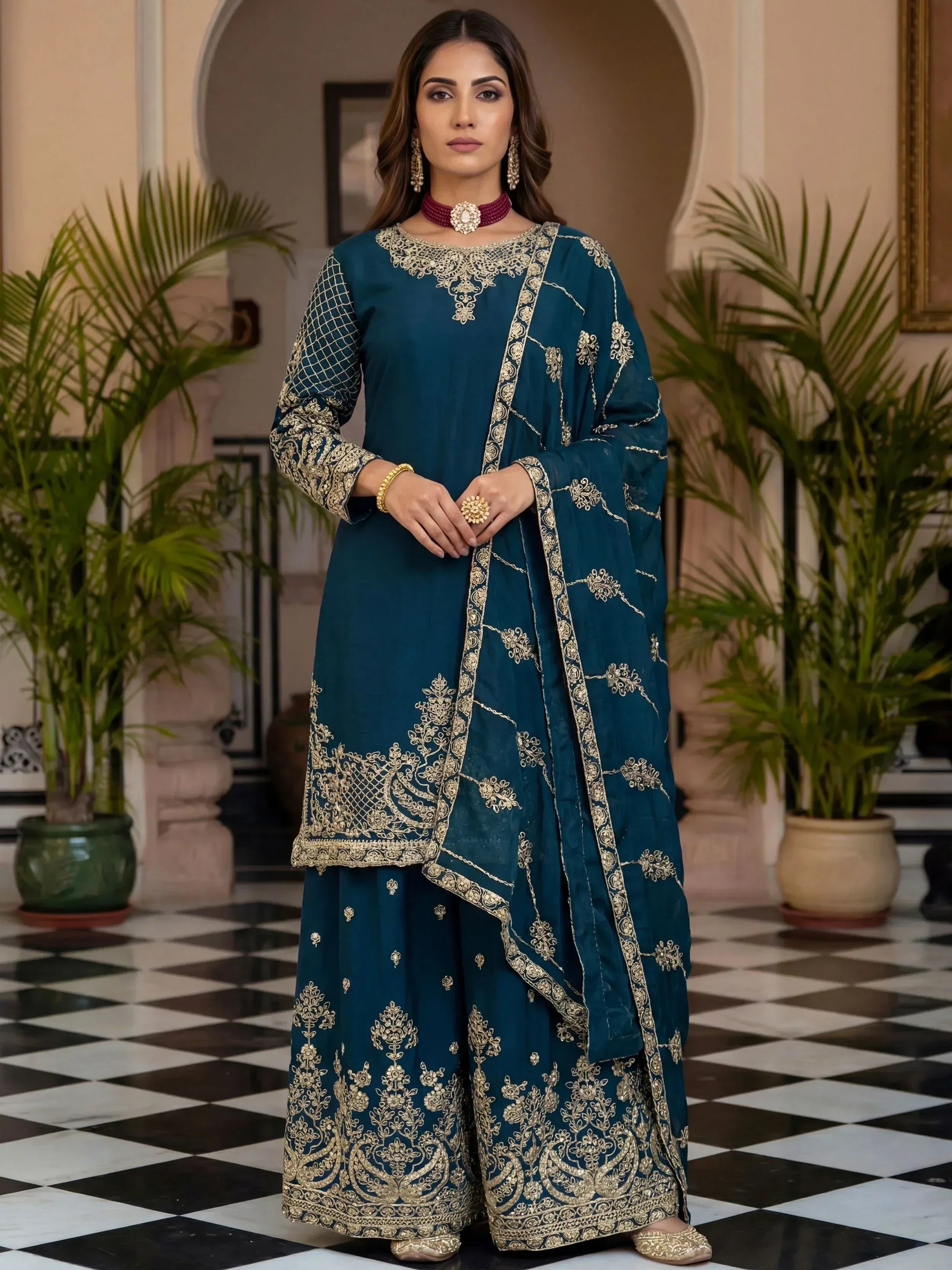 Teal blue embroidered salwar kameez with gold detailing, perfect for Indian ethnic wear occasions