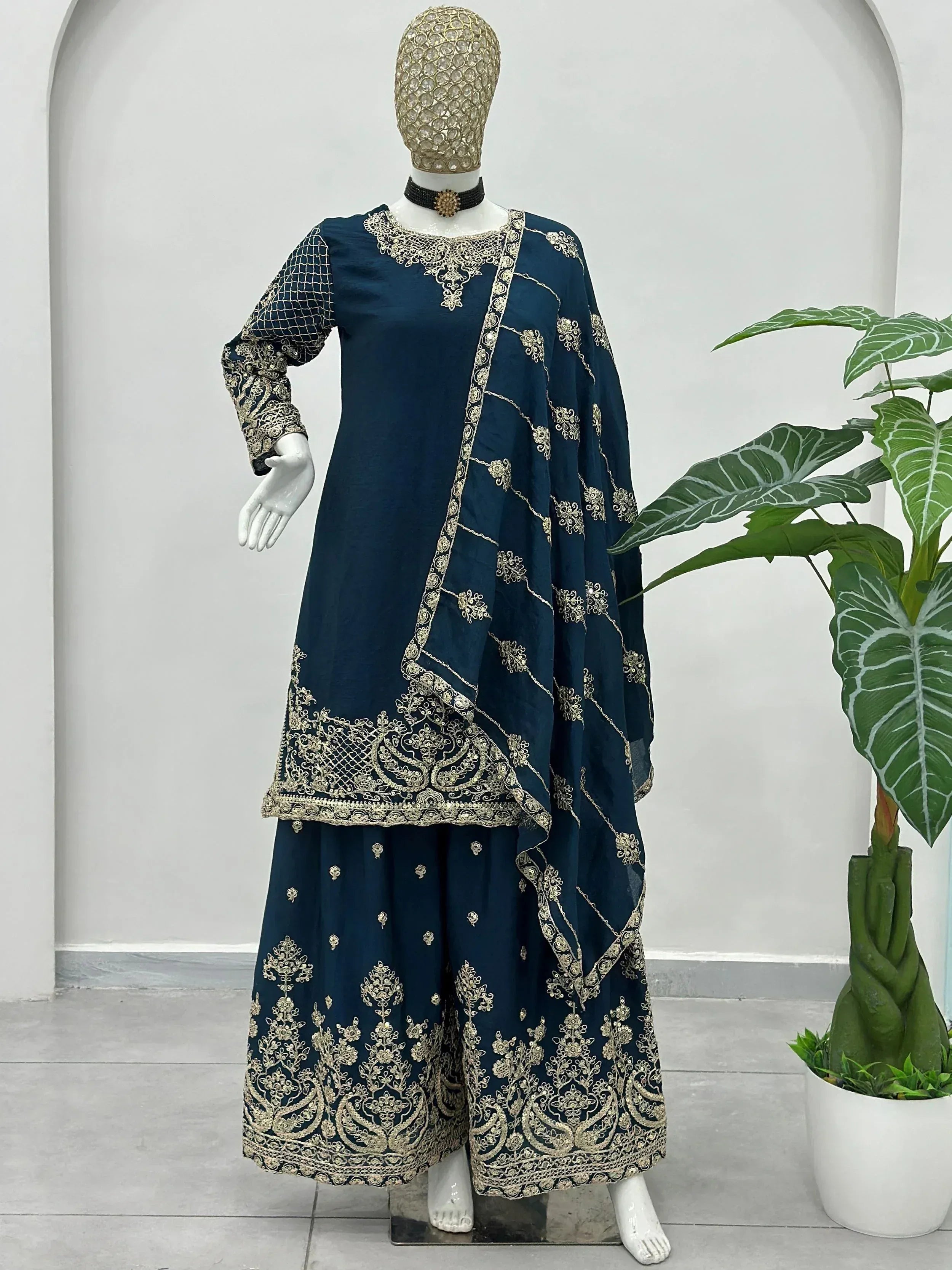 Navy blue ethnic salwar kameez with gold embroidery, perfect for Indian weddings and festive occasions.