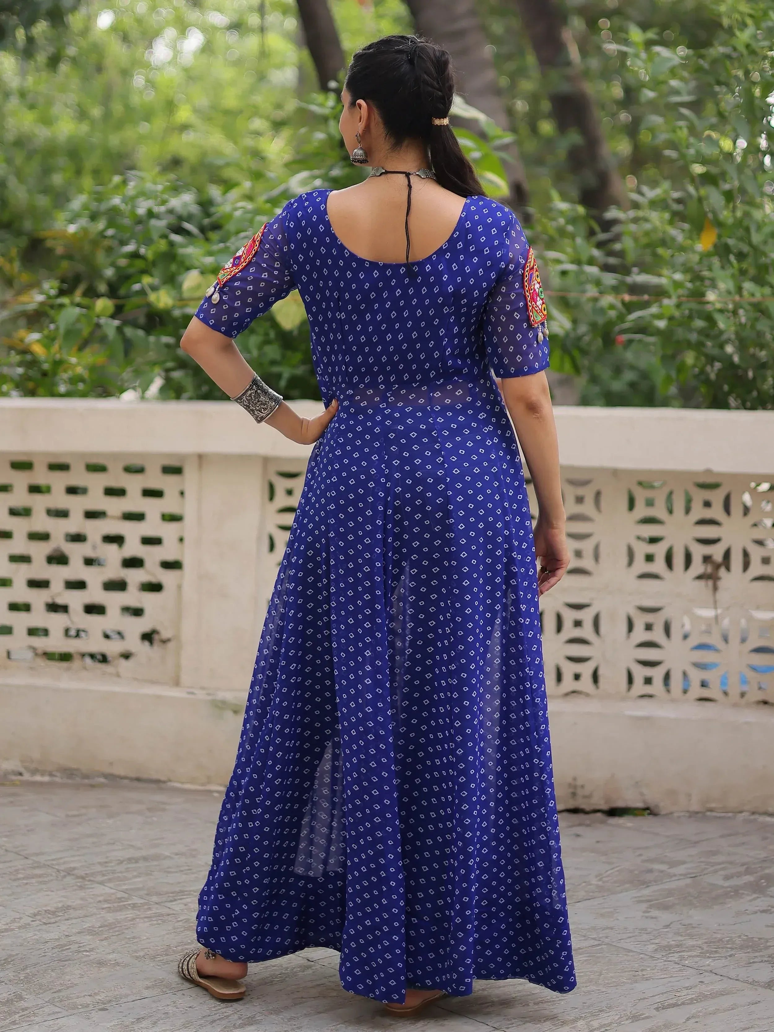 Blue printed ethnic gown with embroidered sleeves, back view, perfect for Indian occasions