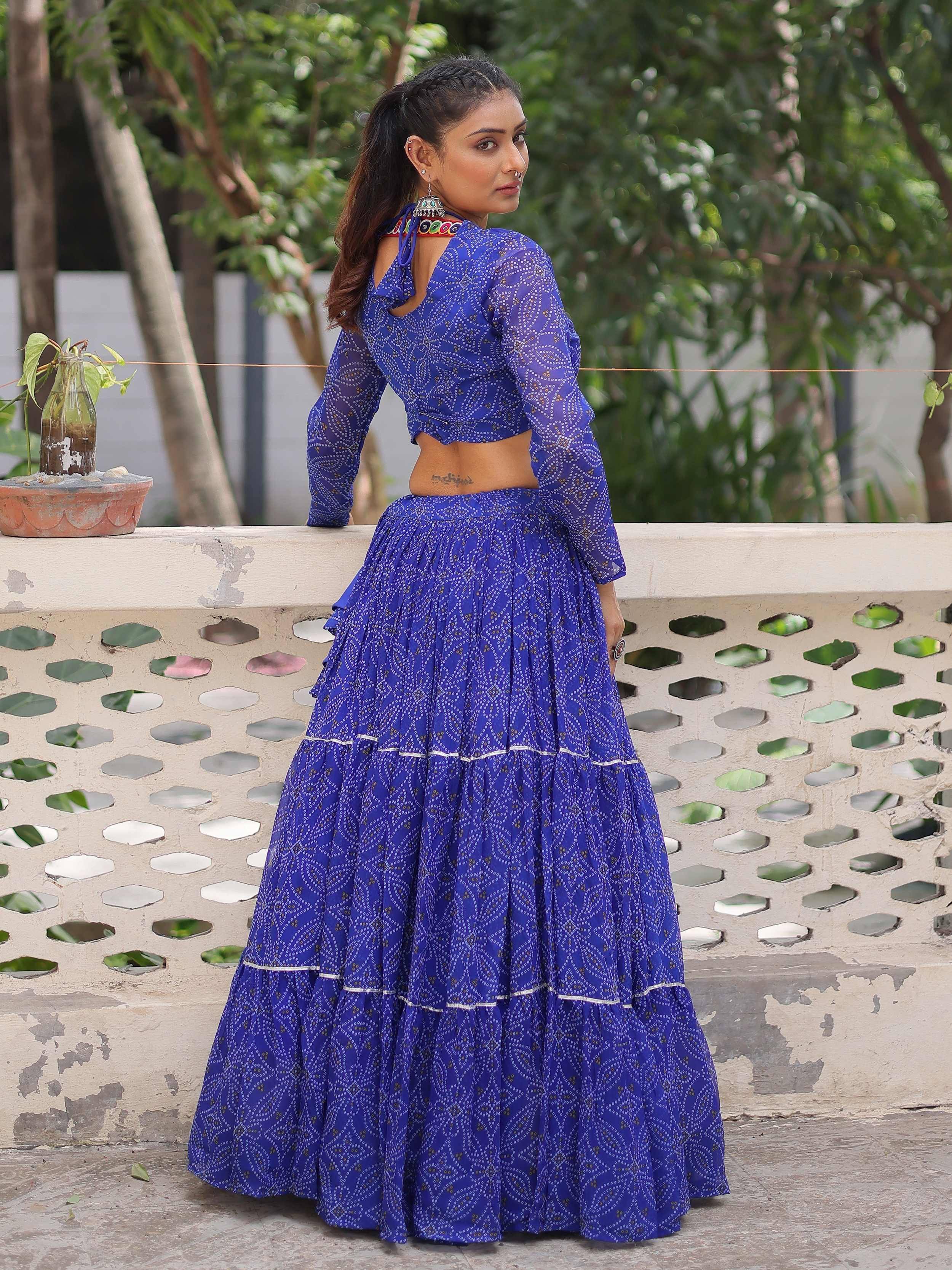 Blue printed lehenga choli with sheer sleeves and back cutout, ethnic wear for women