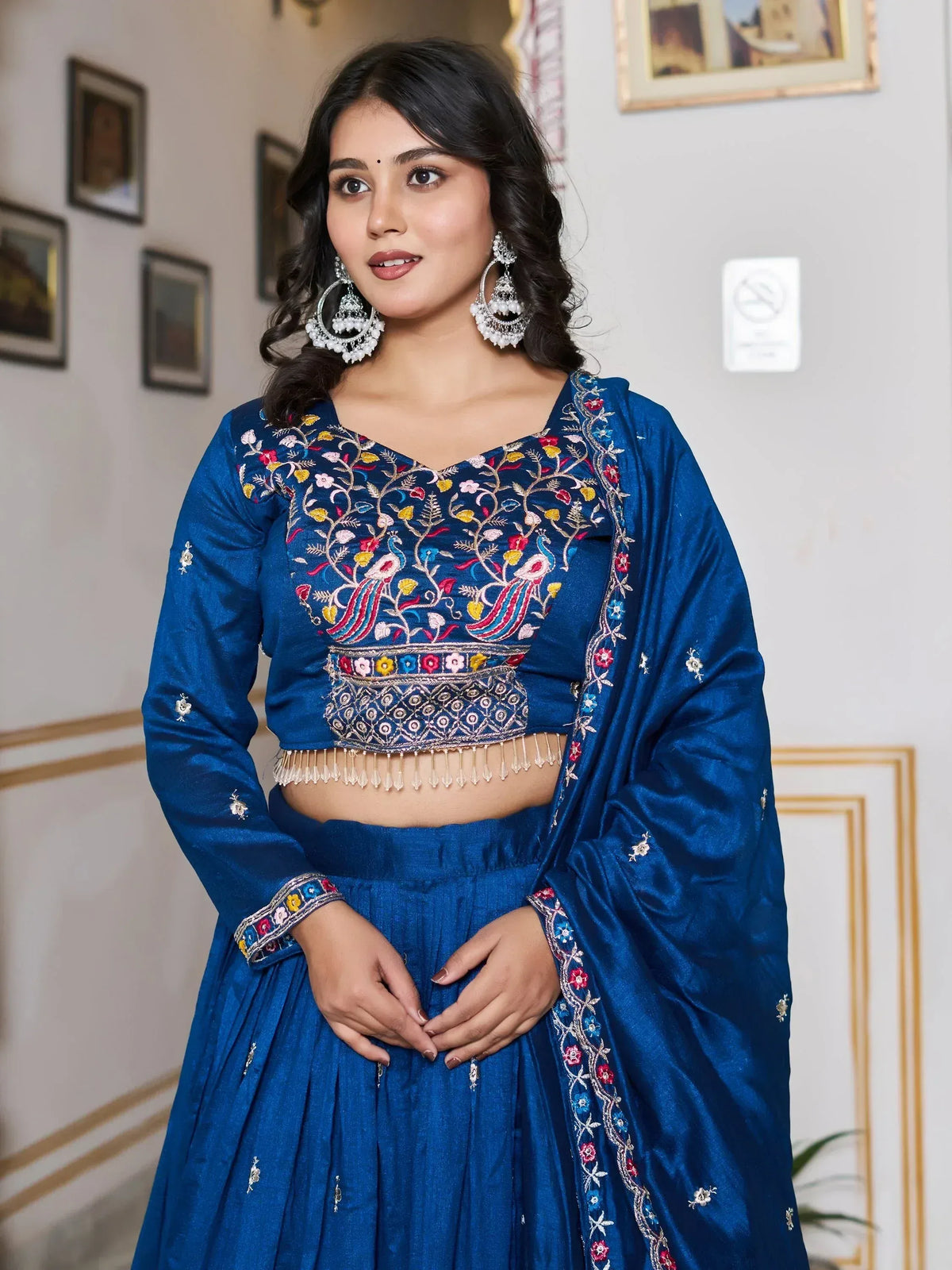 Blue embroidered lehenga choli with peacock design, perfect for Indian ethnic wear occasions