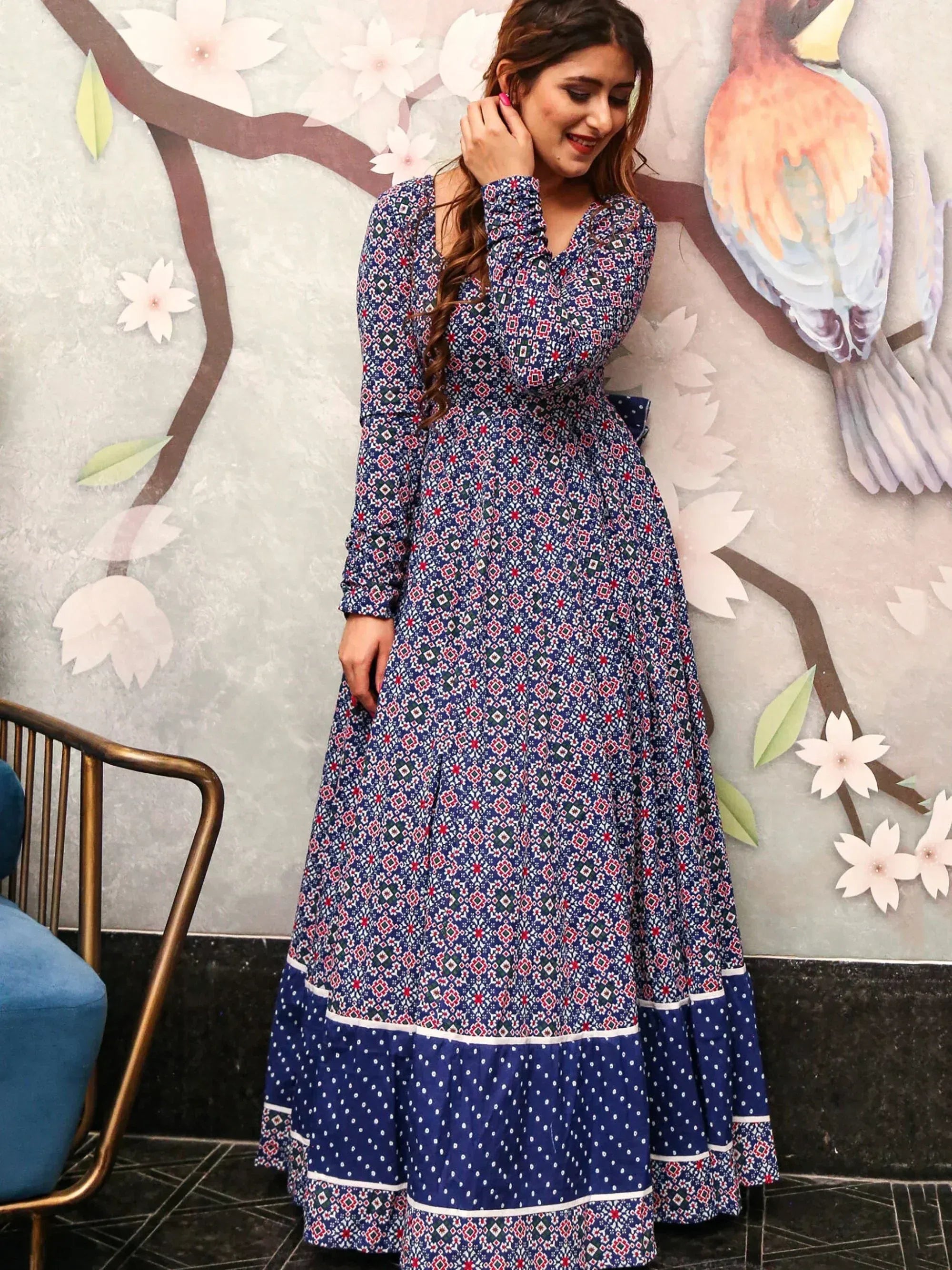Blue printed ethnic gown with geometric patterns and polka dot hem, perfect for Indian occasions