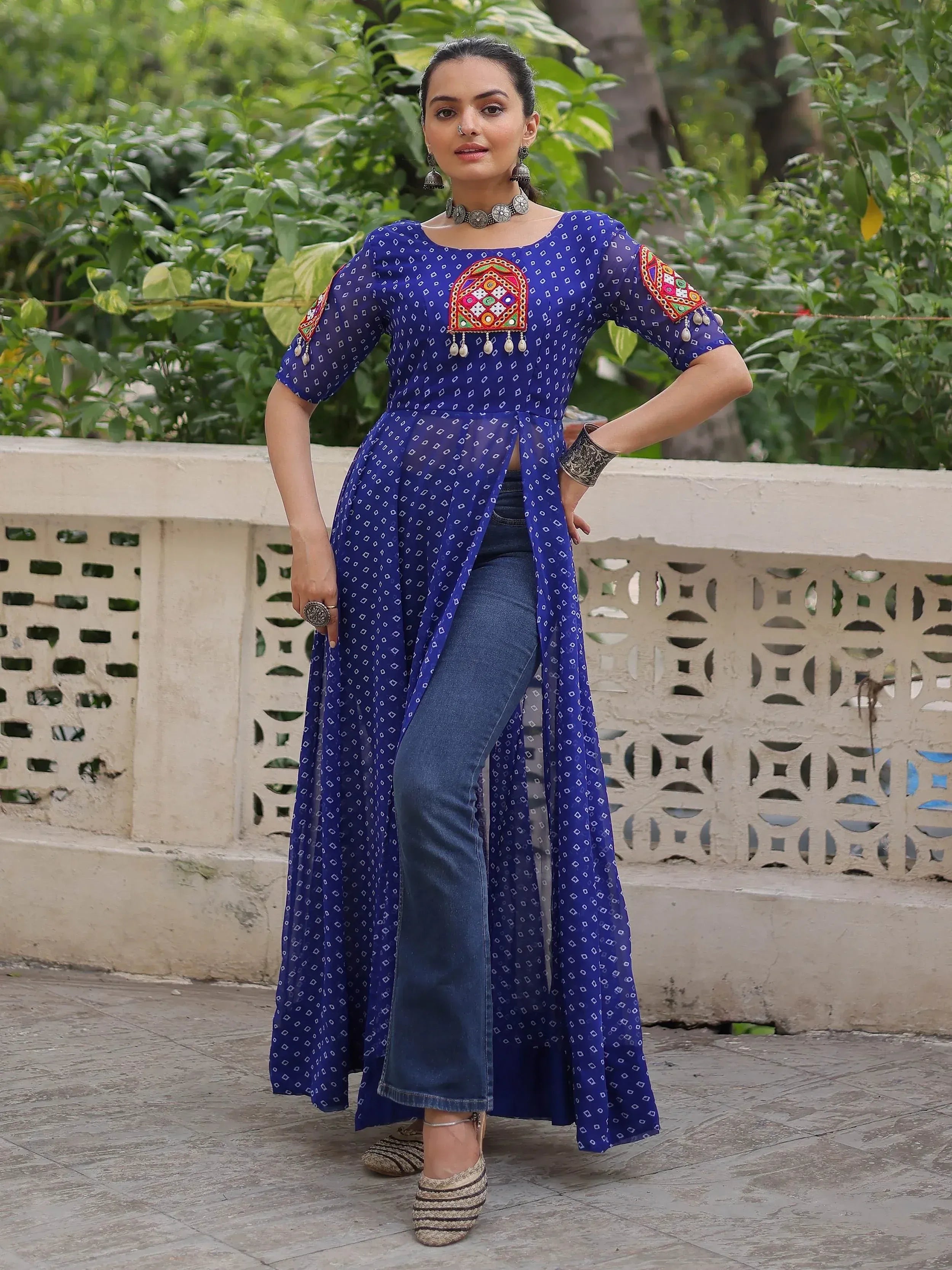 Blue embroidered ethnic kurti with denim jeans, perfect for Indian festive wear and casual occasions.